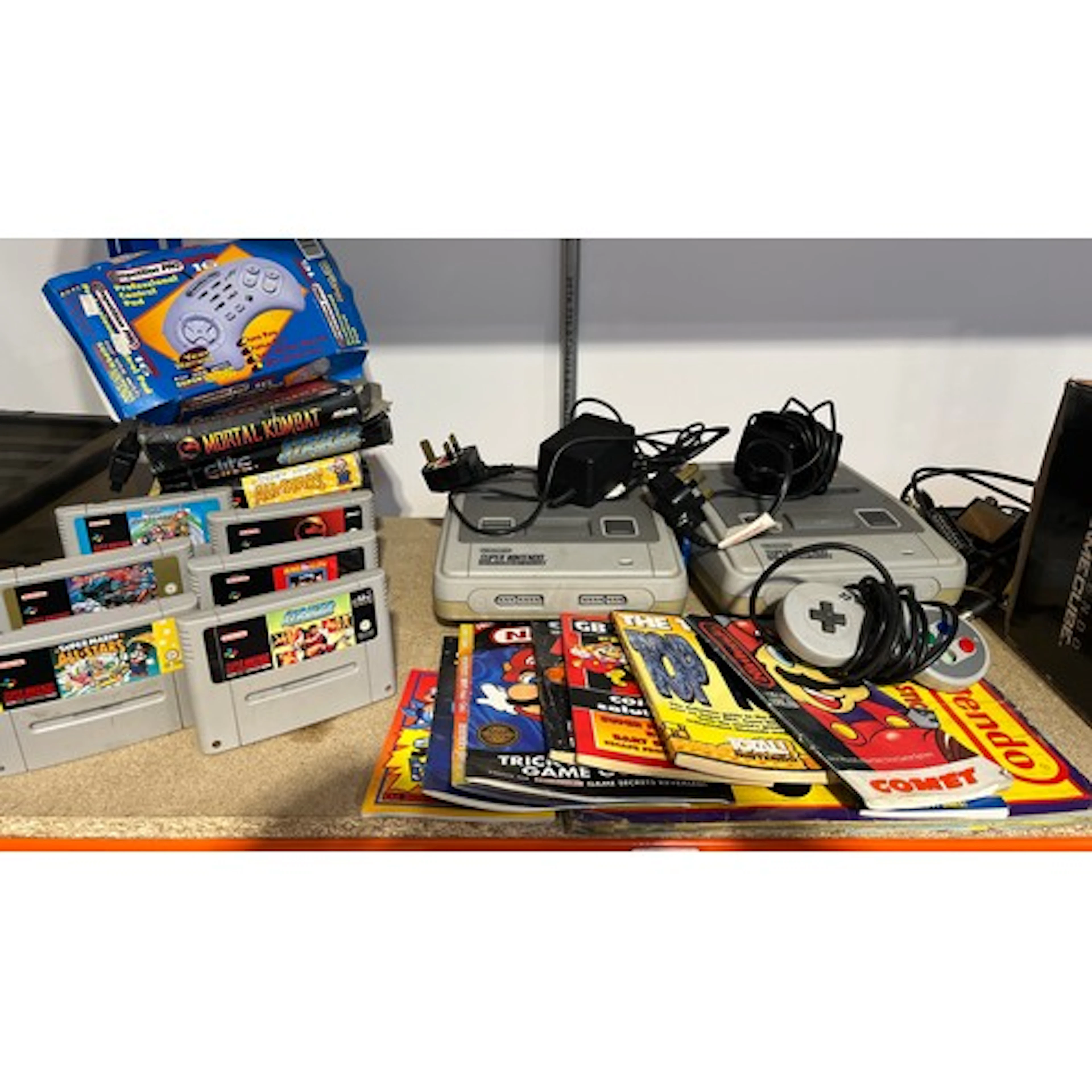 Two Super Nintendo Entertainment System SNES games consoles ...