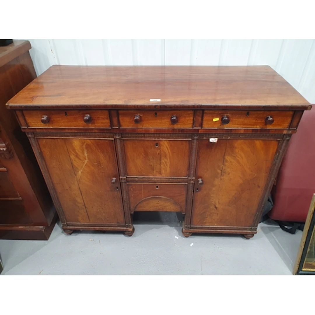 An antique mahogany Sideboard fitted three short drawers abo...