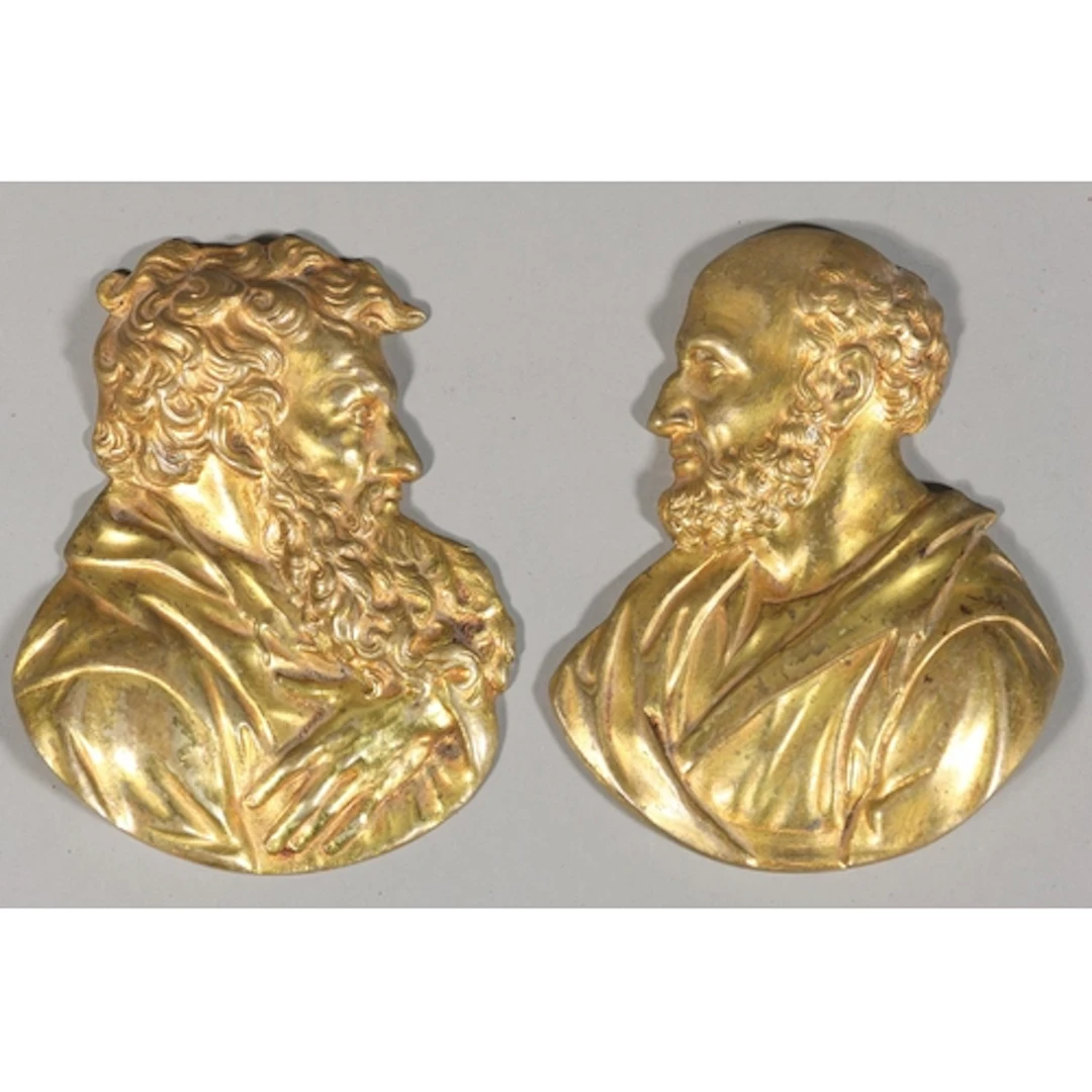 Pair of gilt cast metal plaques of bearded gentlemen, the re...