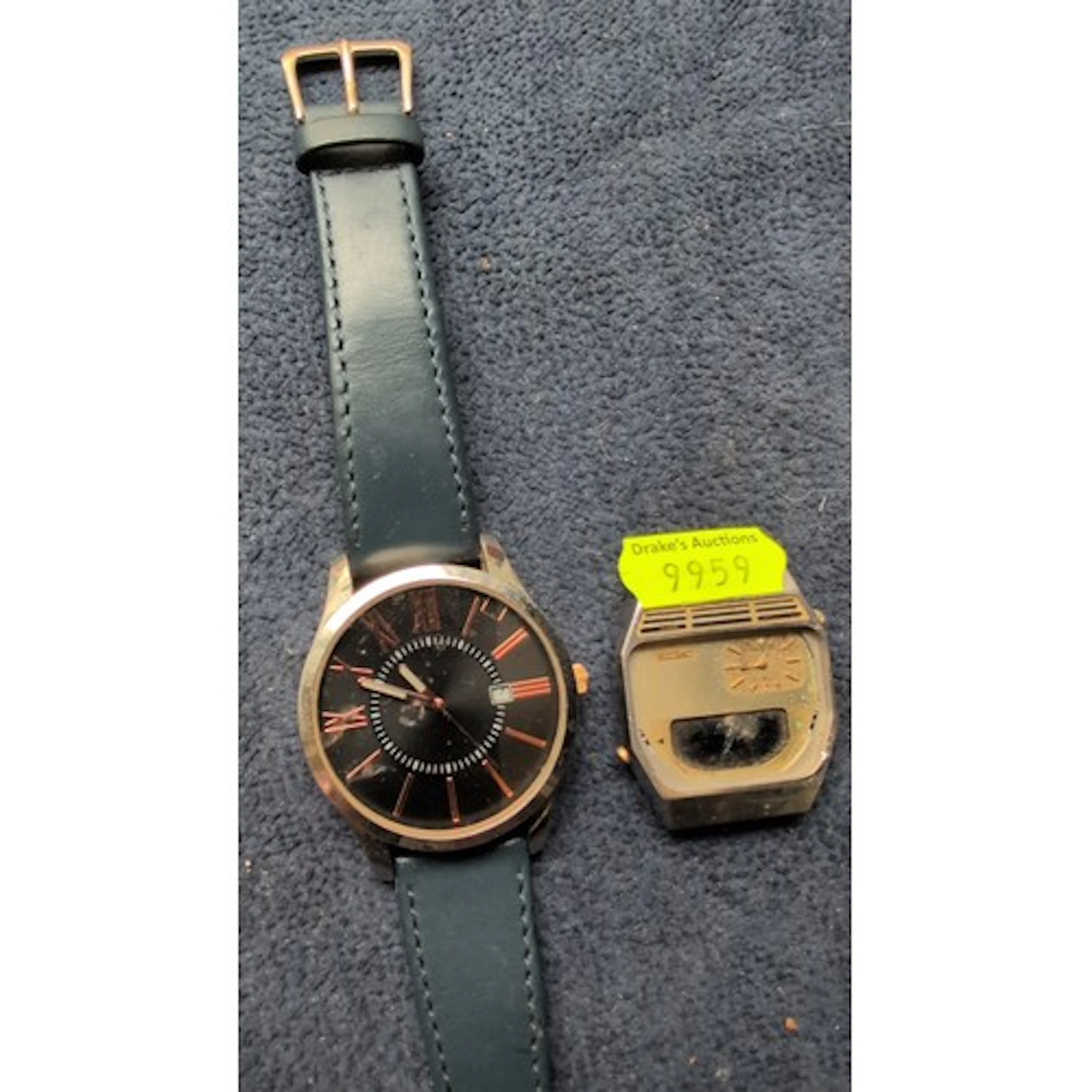 A group of wristwatches: one modern black-dial watch with da...