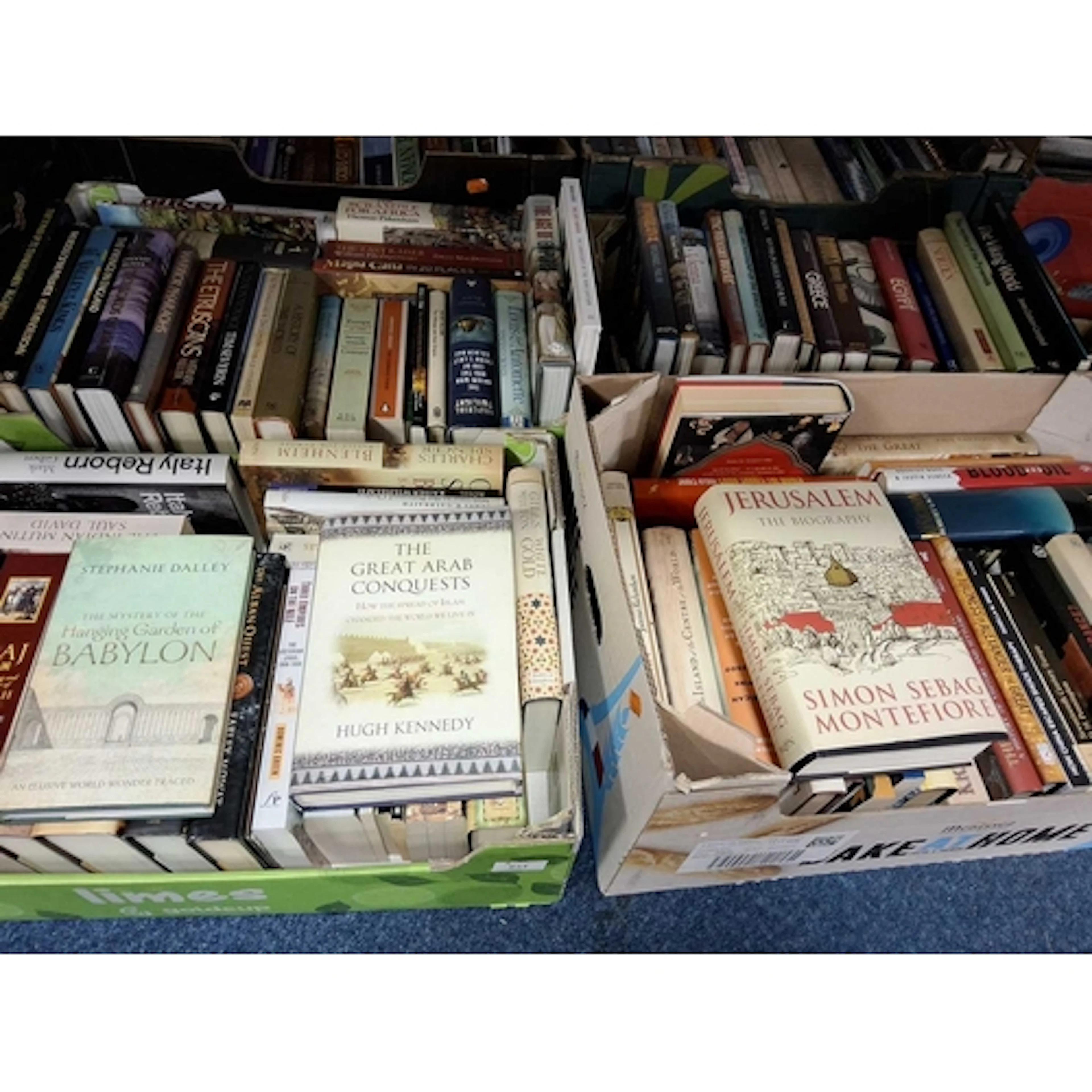 FOUR BOXES OF HARDBACK BOOKS covering subjects such as ancie...