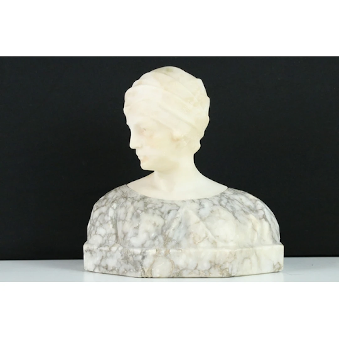 After Guglielmo Pugi; an alabaster and grey marble head and ...