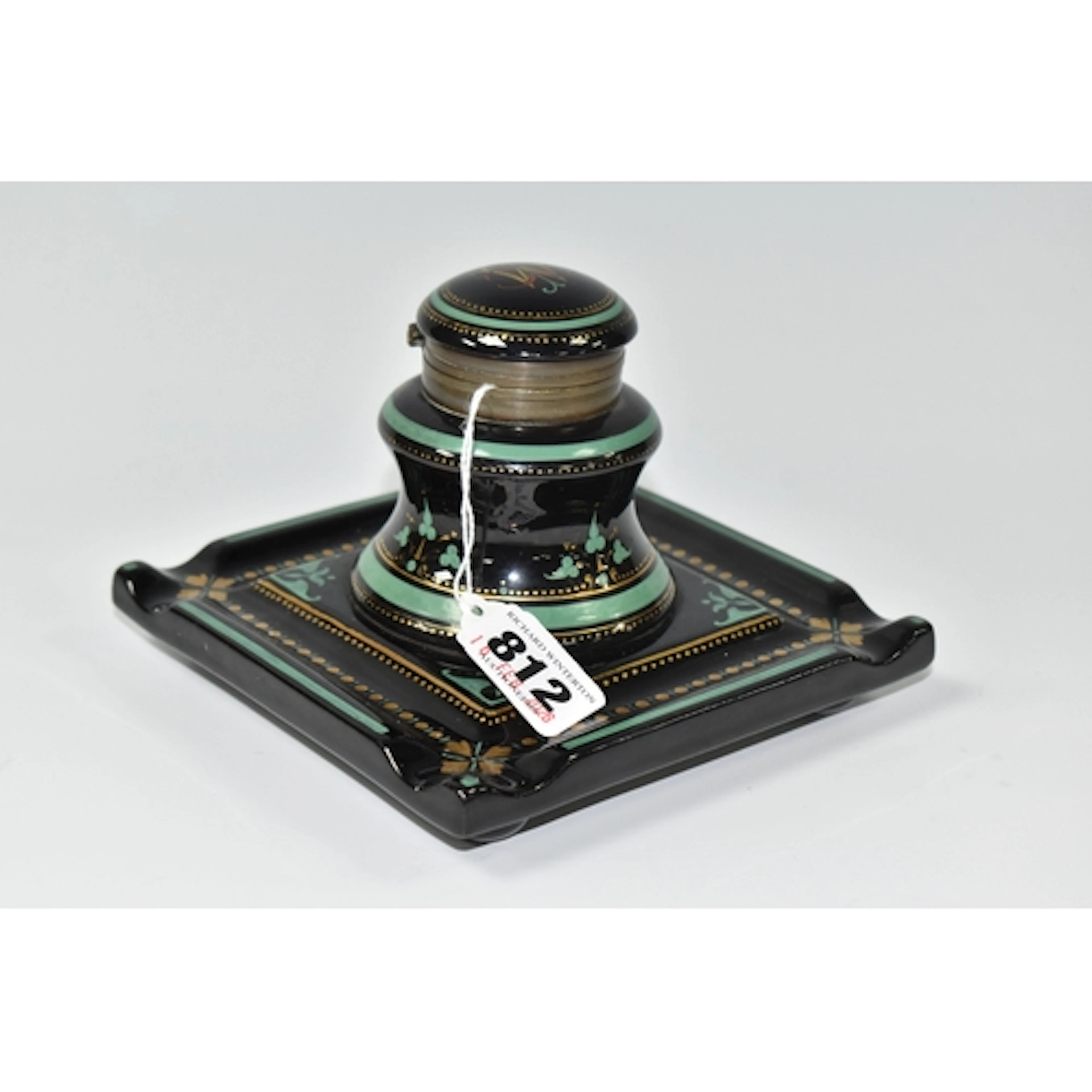 A VICTORIAN CERAMIC DESK INKWELL, its square base with pen r...