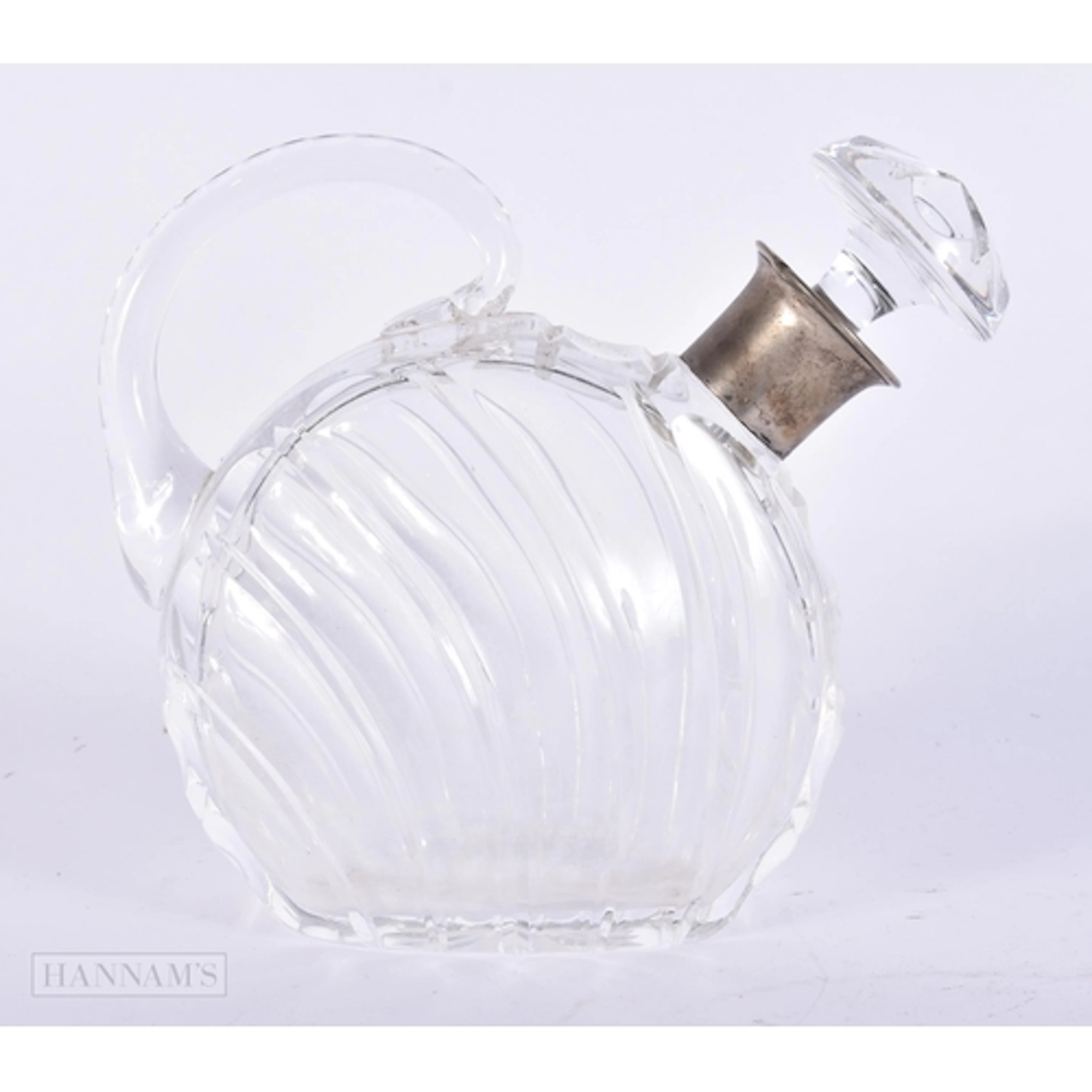 AN ART DECO SILVER MOUNTED GLASS DECANTER AND STOPPER. 17 cm...