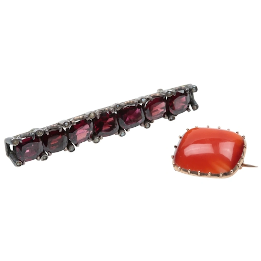 A garnet brooch and a carnelian brooch, late 19th century, c...