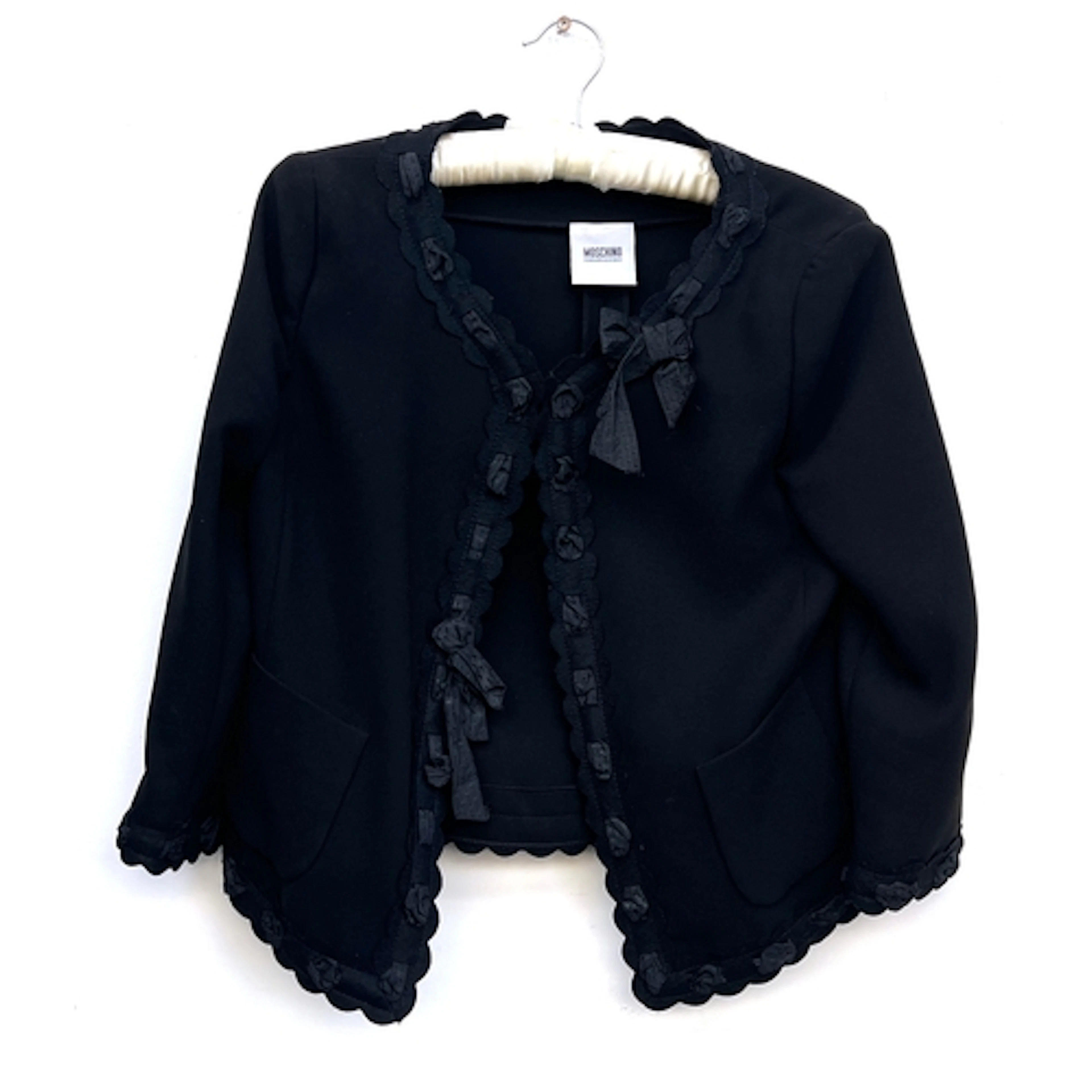 A Moschino black top with bow detail, approx. size US 10