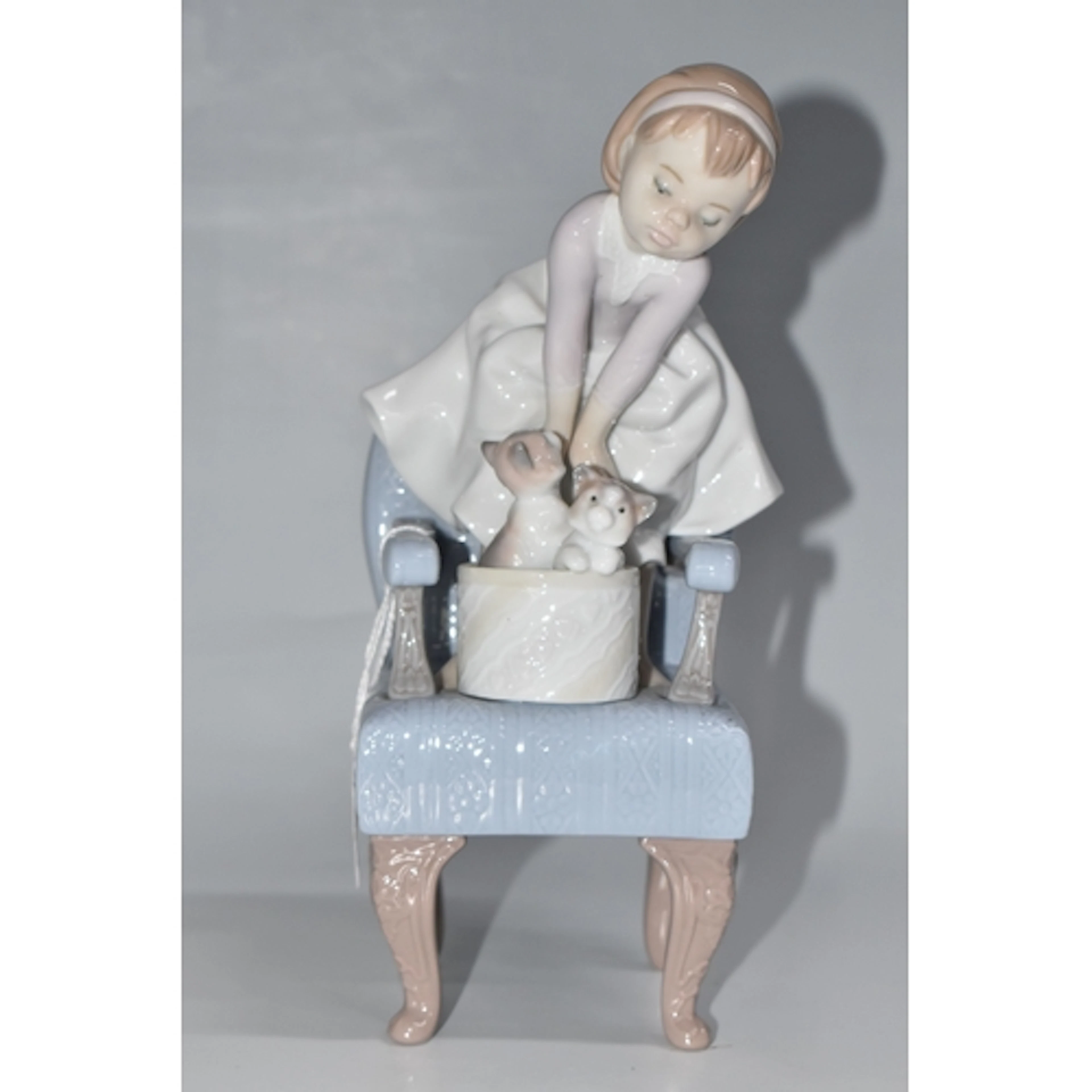 A LLADRO 'PURR-FECT FRIENDS' FIGURE, modelled as a little gi...