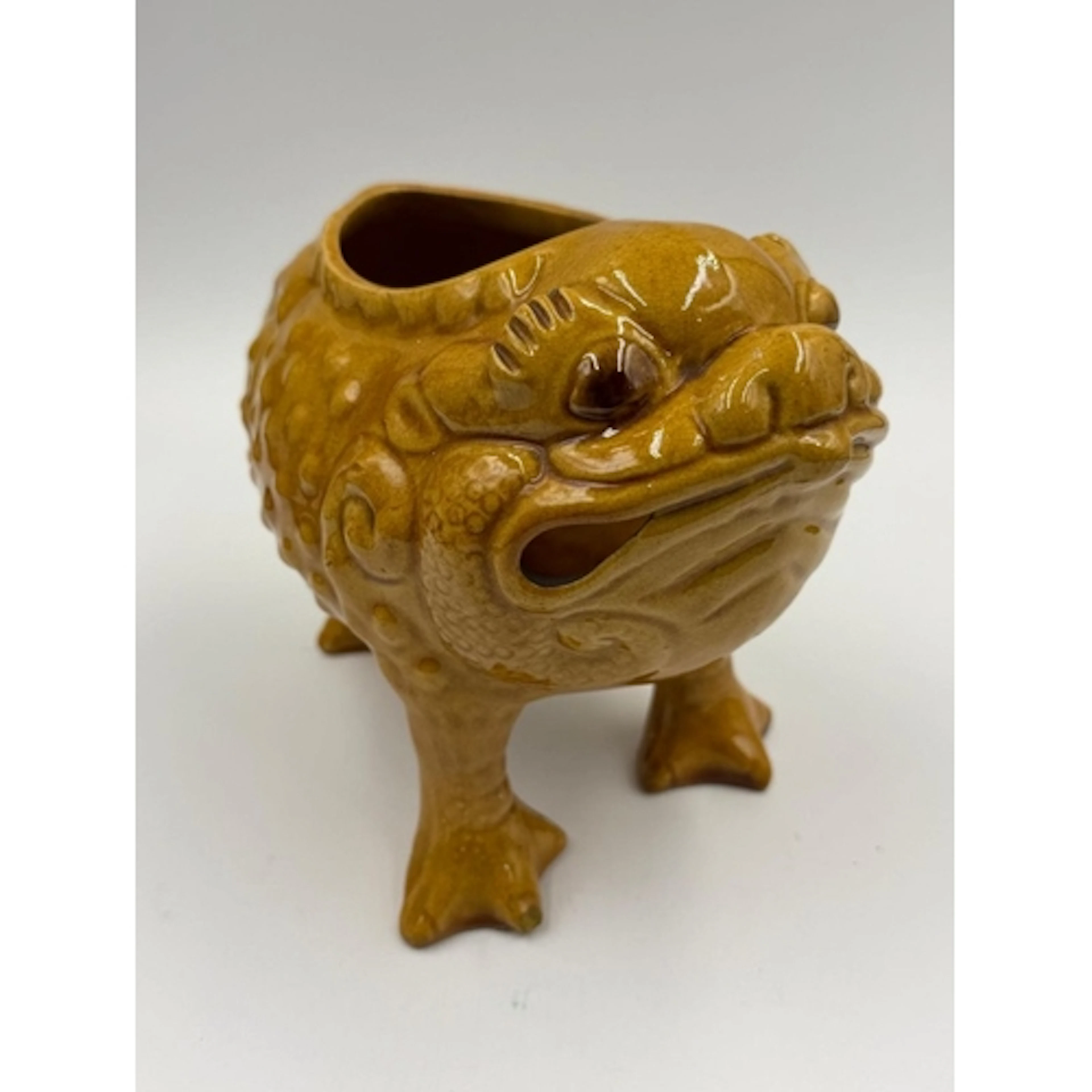 A Dumore mustard grotesque frog, marked to base, approximate...