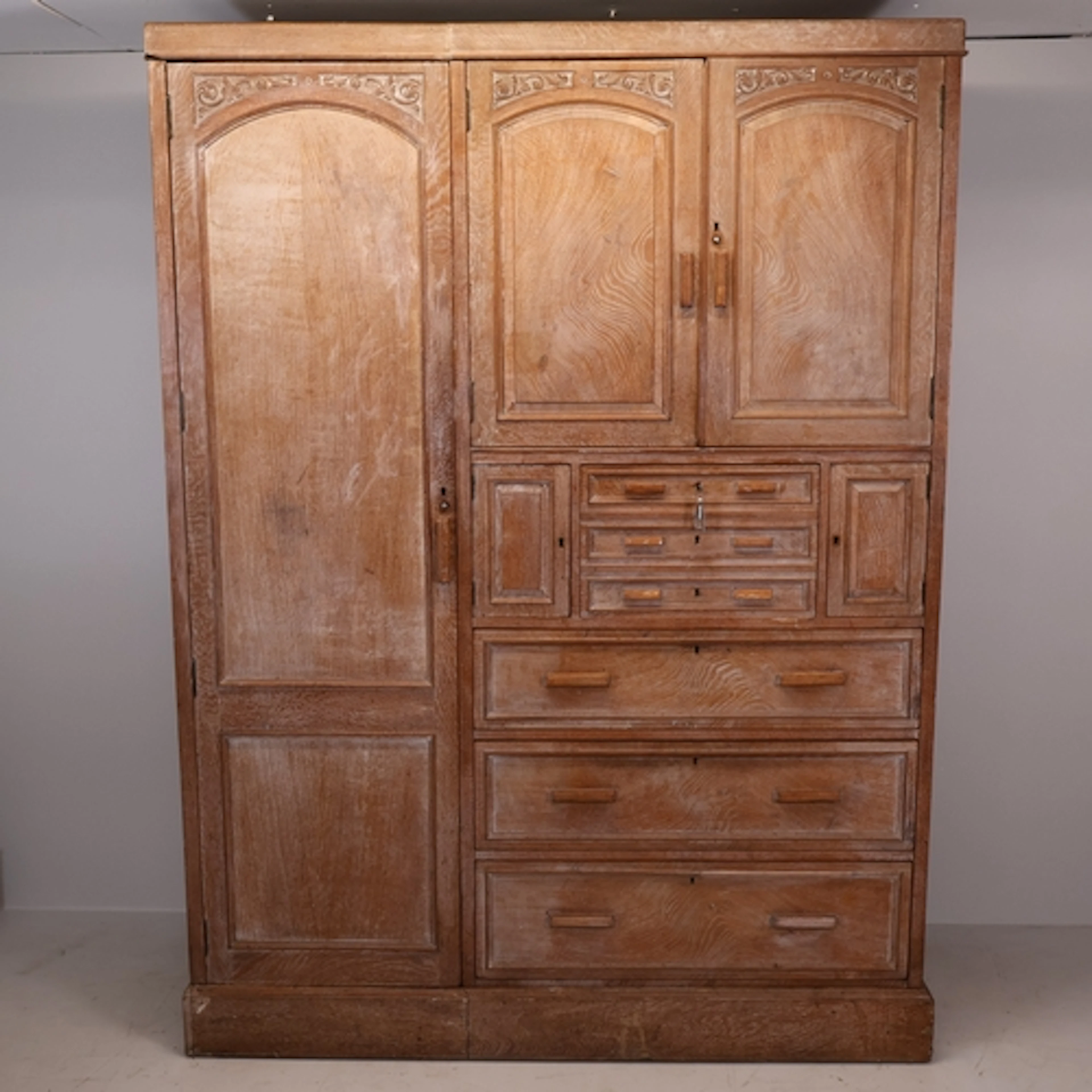 Heal & Son, London - A late 19th century limed oak four sect...