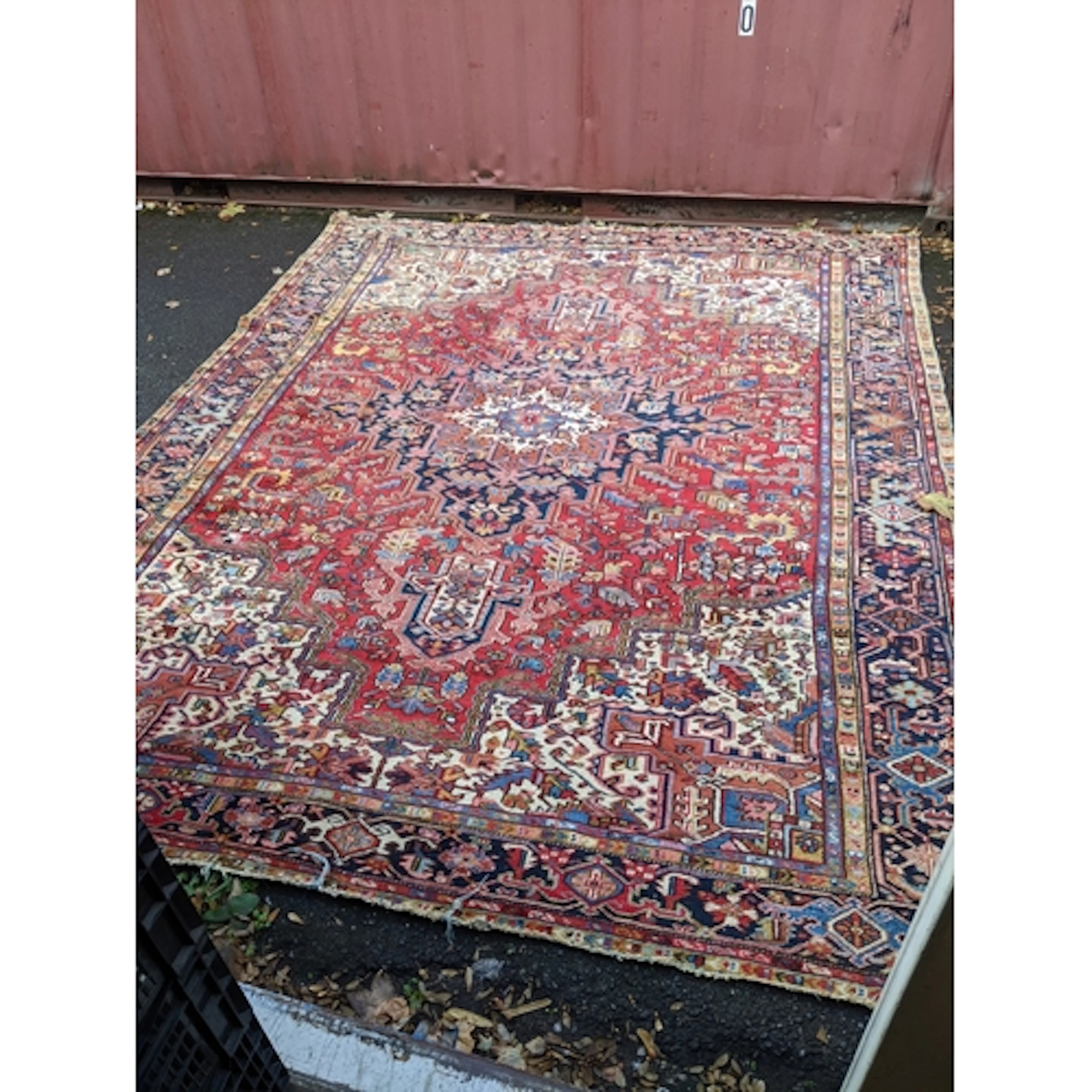 A Persian, probably Heriz hand knotted wool carpet, red grou...