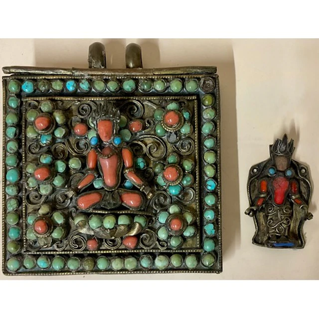 A Tibetan brass gau box, decorated with depctions of Vishnu ...