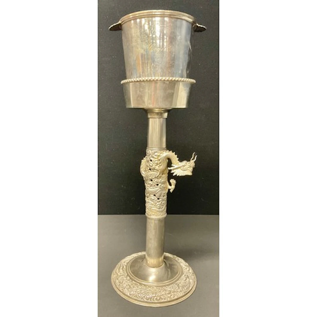 A Chinese style silver plated wine cooler stand cast in reli...