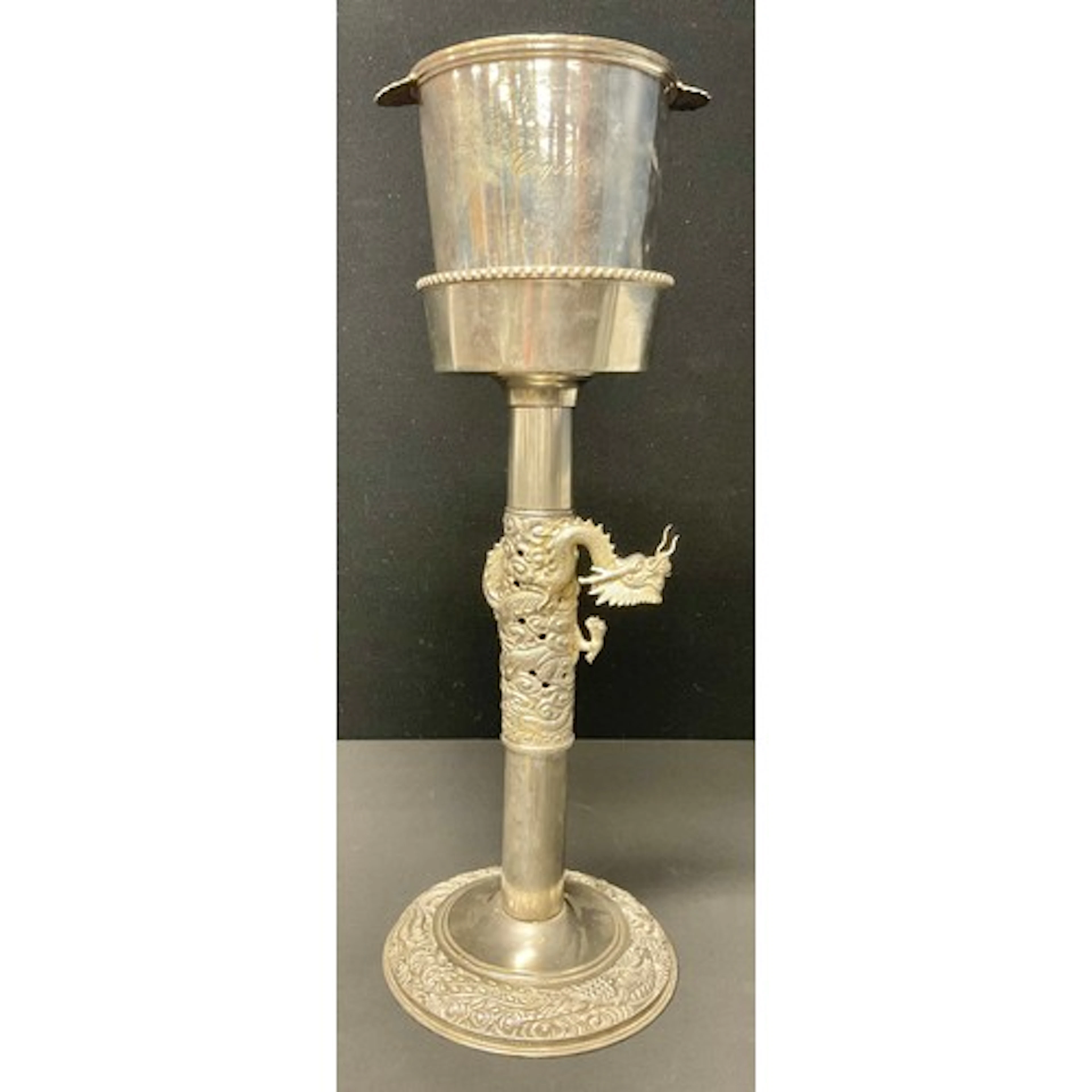 A Chinese style silver plated wine cooler stand cast in reli...