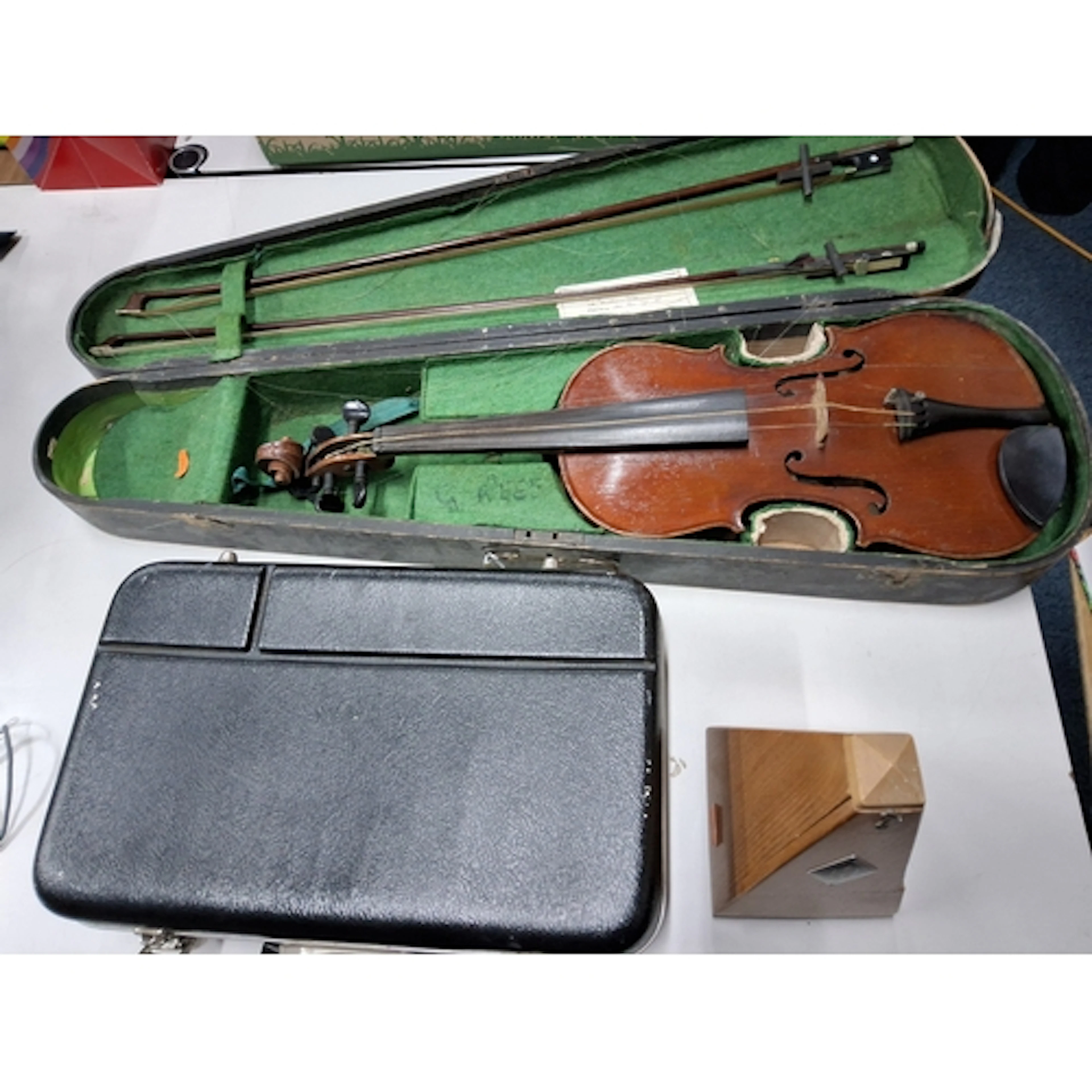 A VIOLIN, A CASED CLARINET AND A METRONOME, comprising a cas...