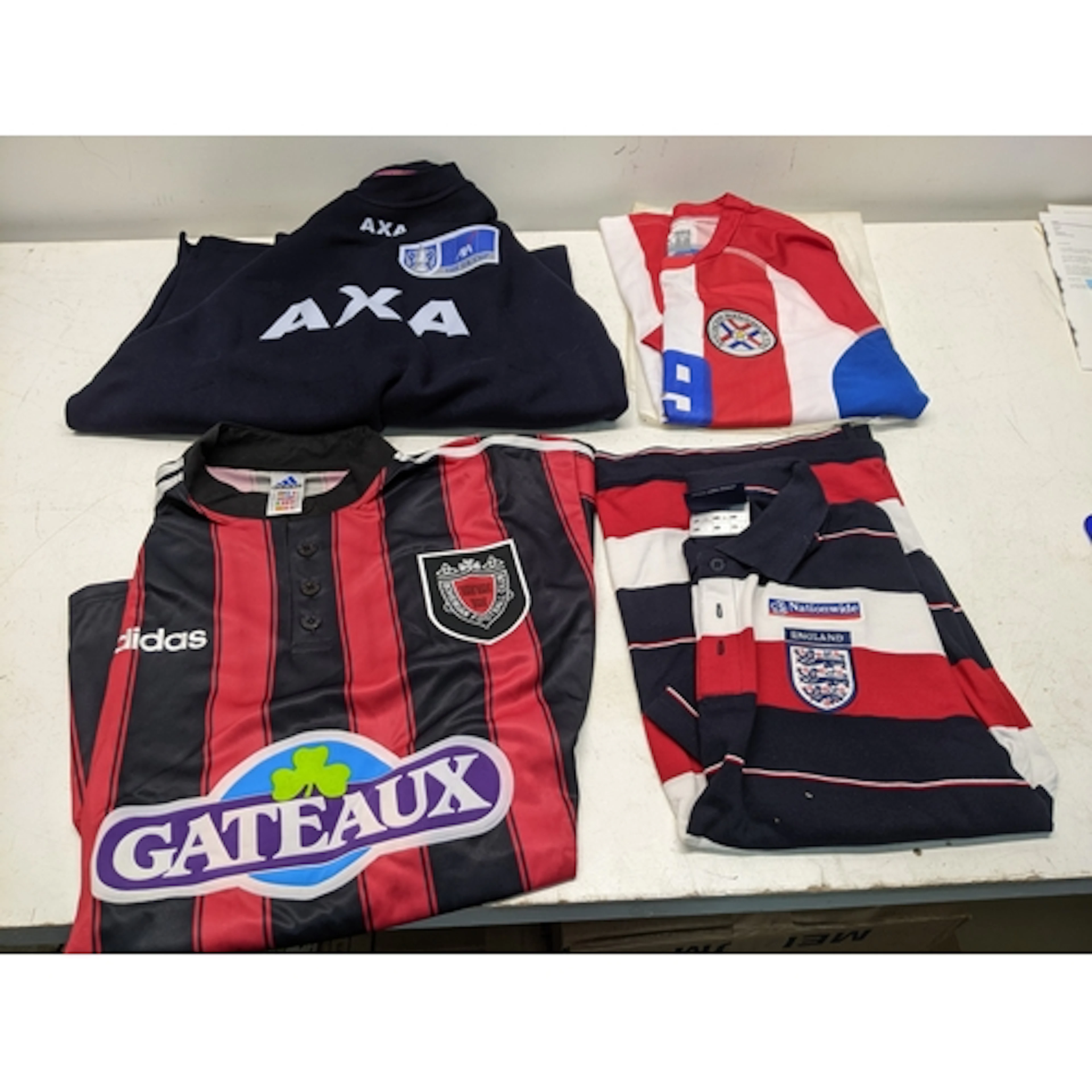 A group of three vintage football shirts, and a sweatshirt, ...