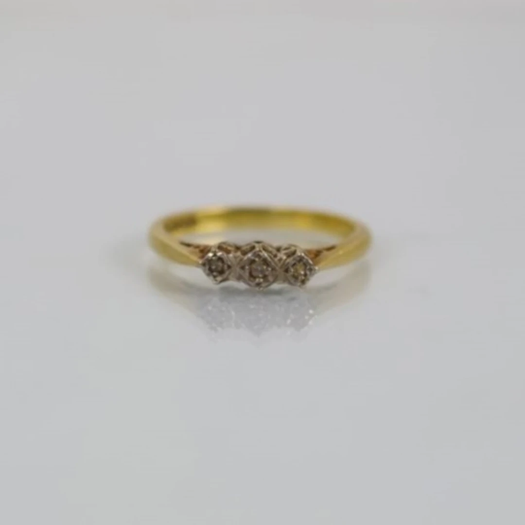 A mid/late 20th century diamond three stone ring, the three ...