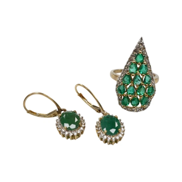 A modern 9ct gold, emerald and diamond set pear shaped clust...