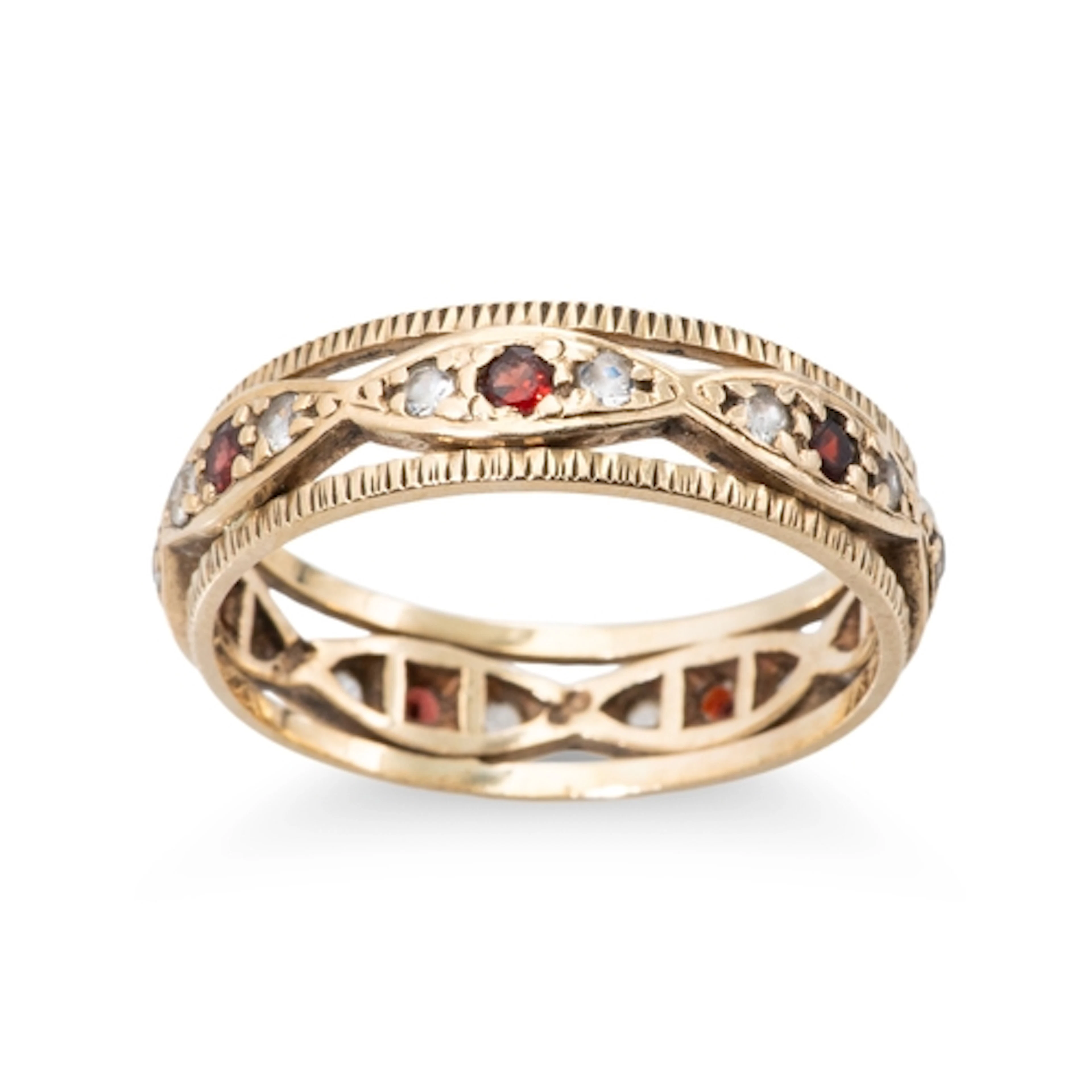 A 9CT YELLOW GOLD VINTAGE BAND RING, set with garnet etc., s...