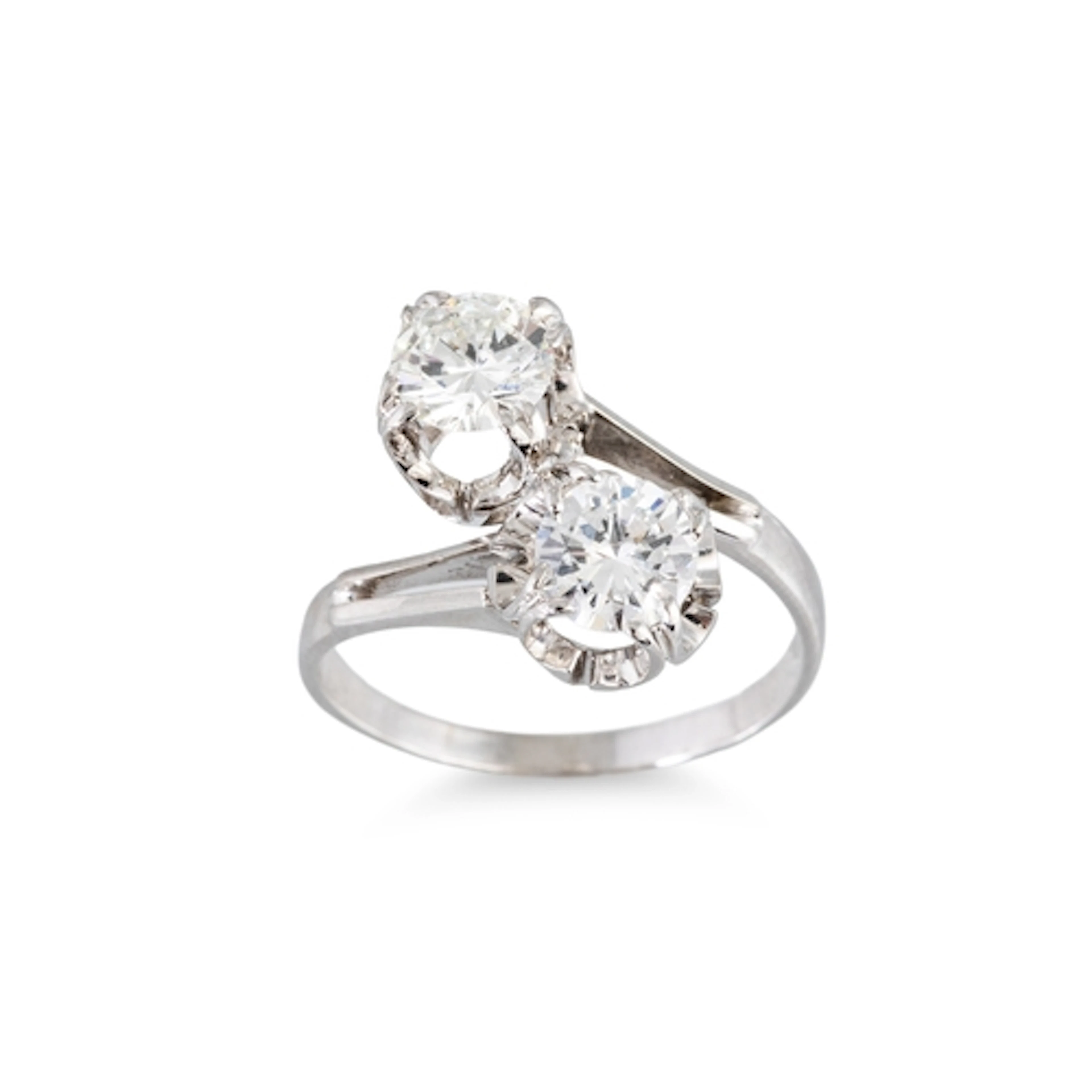 A DIAMOND 'TOI ET MOI' CROSS-OVER RING, the brilliant cut di...