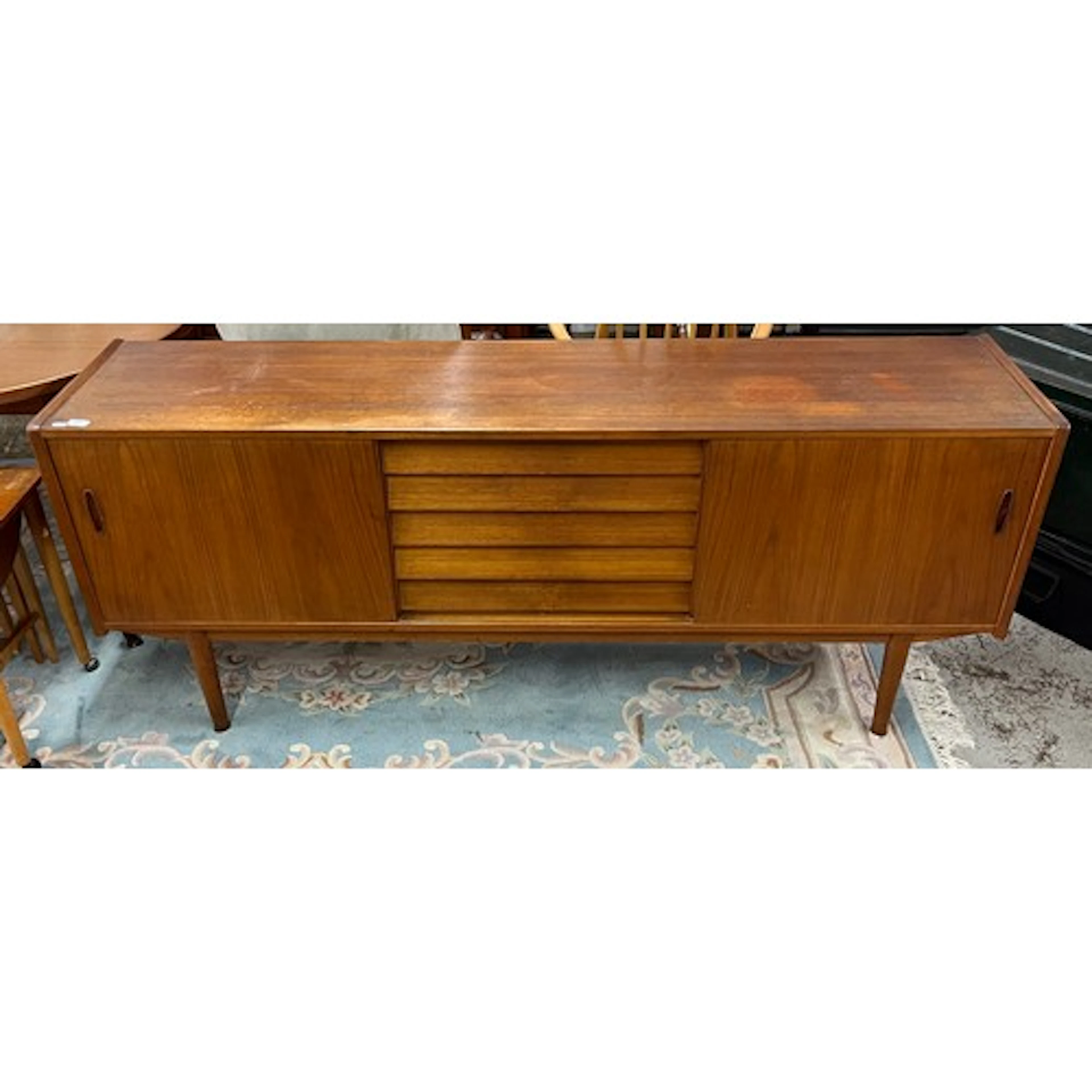 Mid-century teak sideboard with five central drawer, flanked...