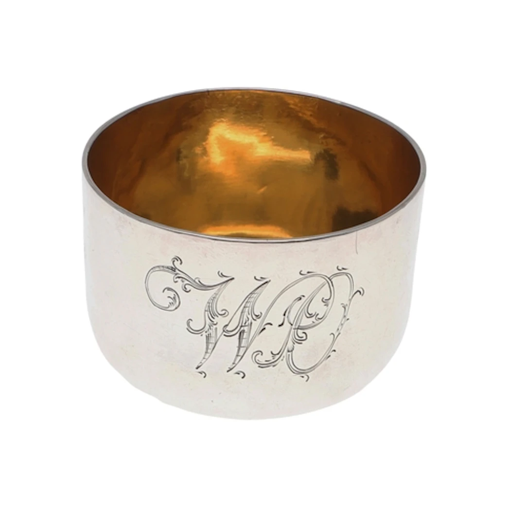A GEORGE III SMALL SILVER TUMBLER CUP. With a gilt interior,...