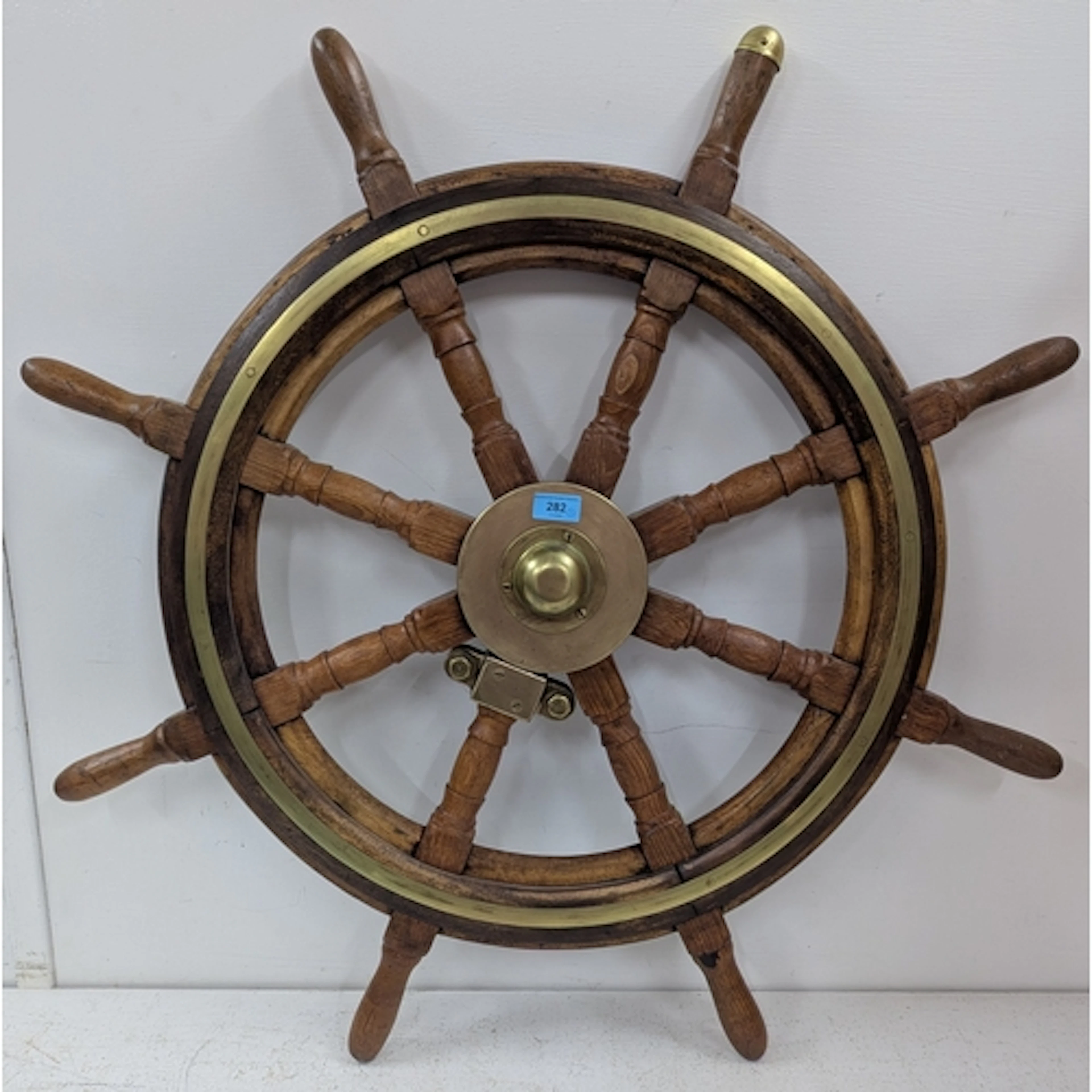 A late 19th/early 20th century eight spoke steering helm, ma...