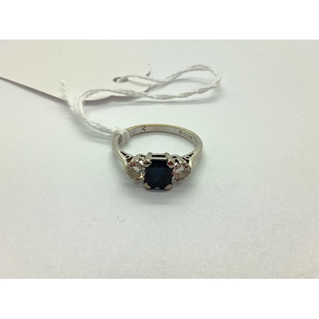 An 18ct White Gold Three Stone Ring, rectangular claw set ce...
