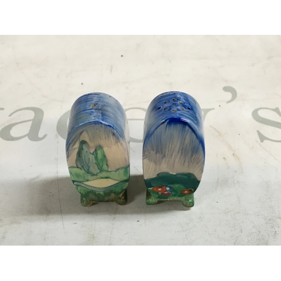 A pair of hand painted Clarice Cliff salt and pepper shakers...