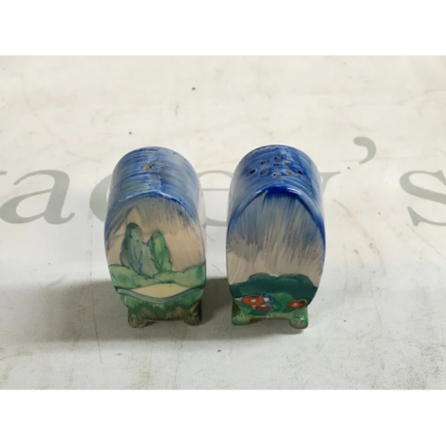 A pair of hand painted Clarice Cliff salt and pepper shakers...