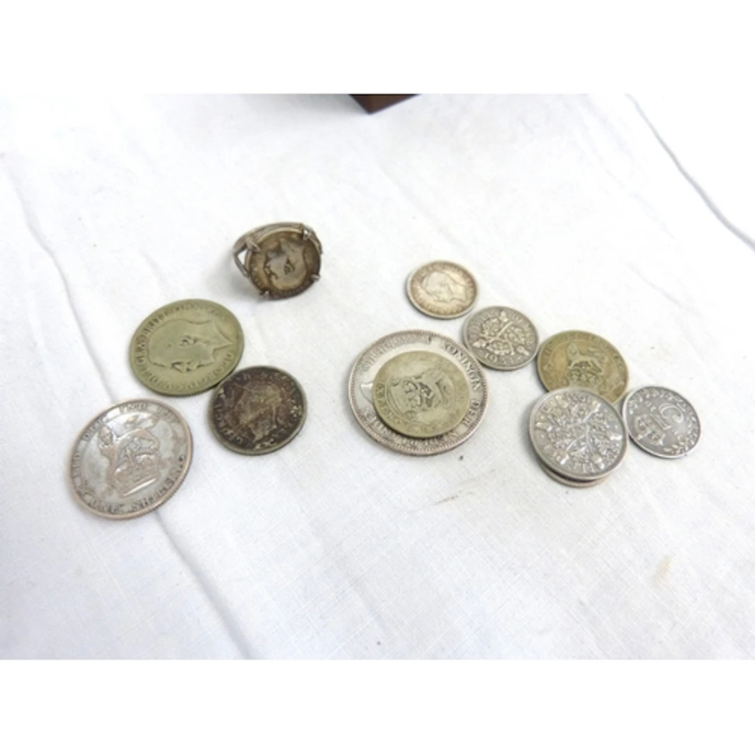 Small bag of silver coinage and silver coin ring.