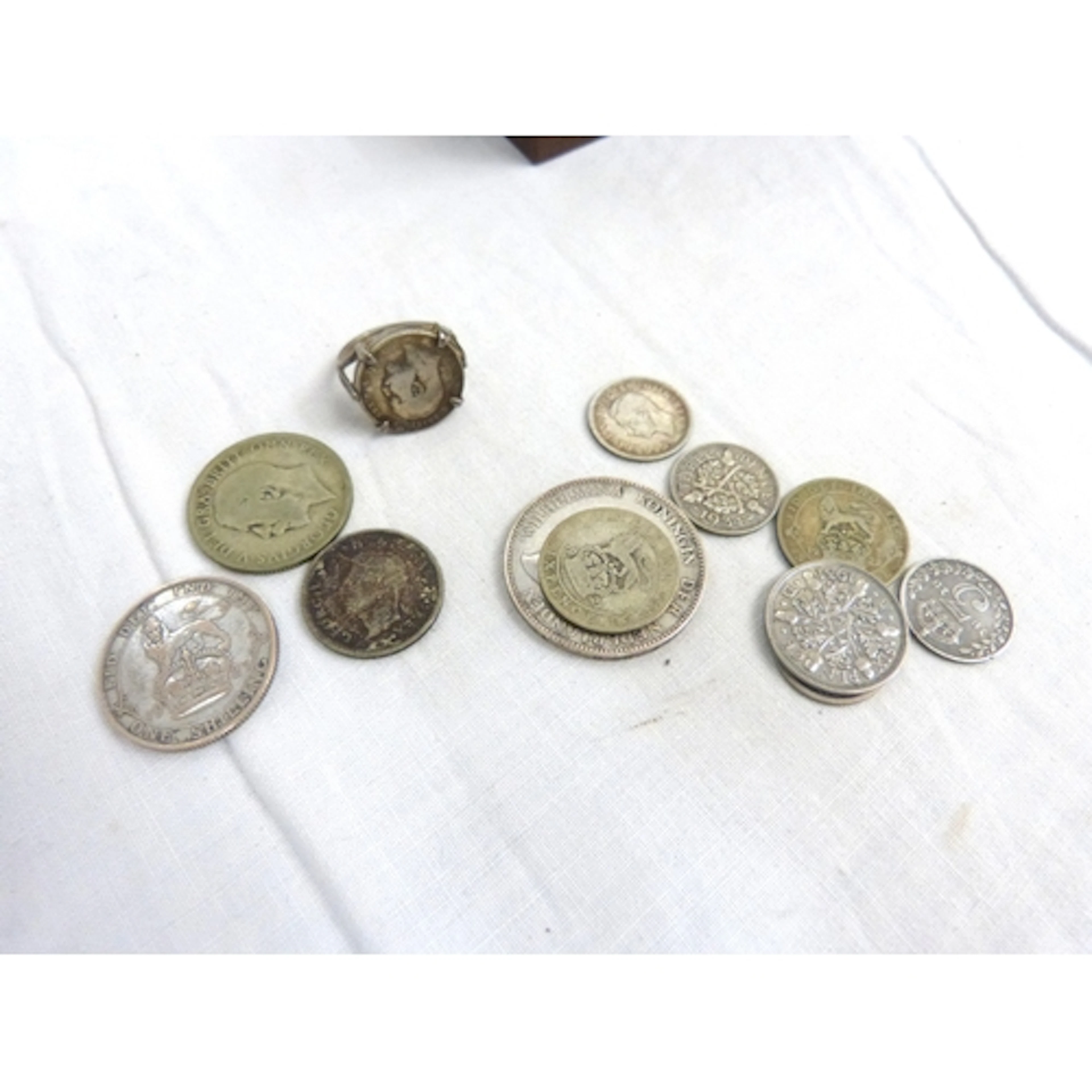 Small bag of silver coinage and silver coin ring.