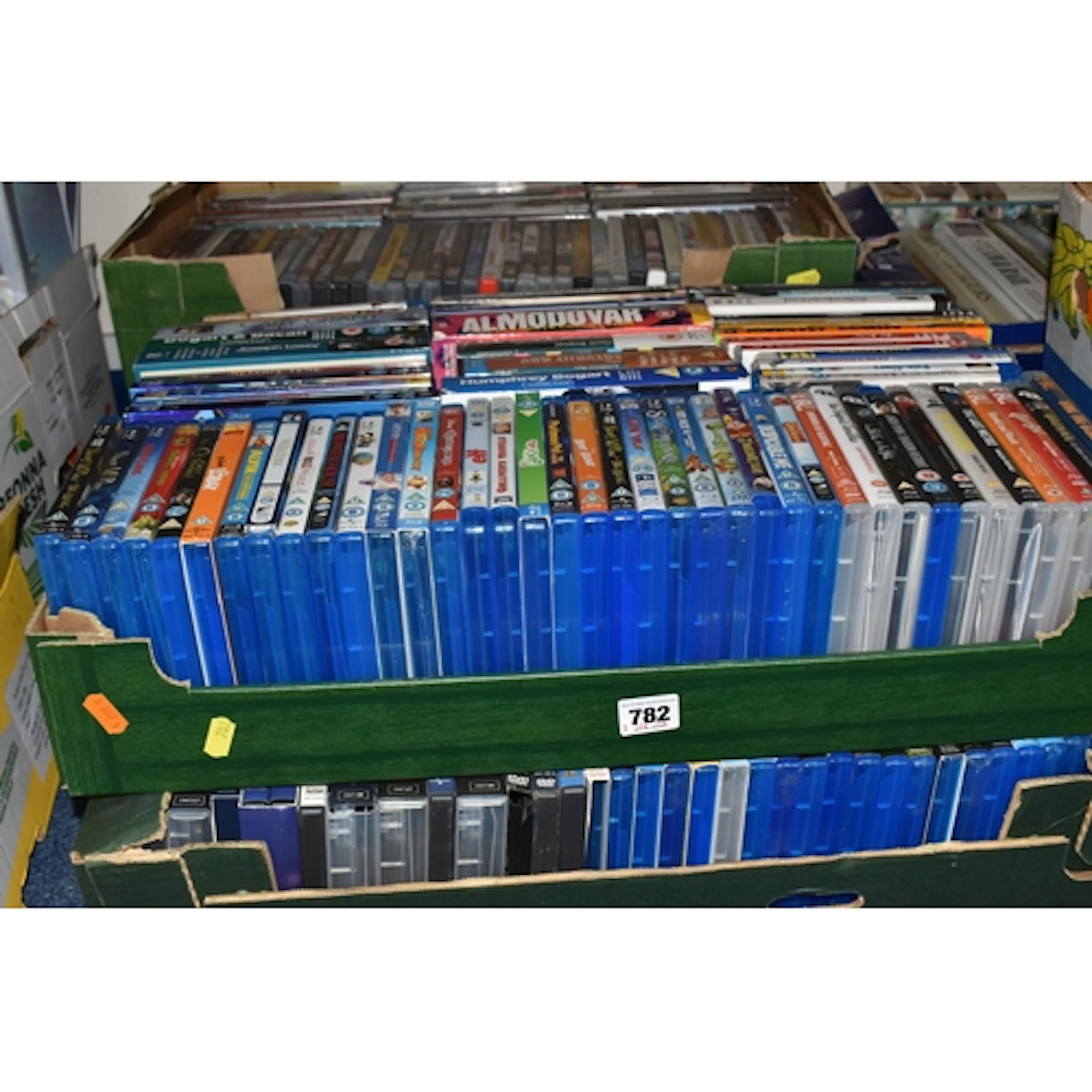 FOUR BOXES OF BLU RAY AND DVD TITLES to include two boxes of...
