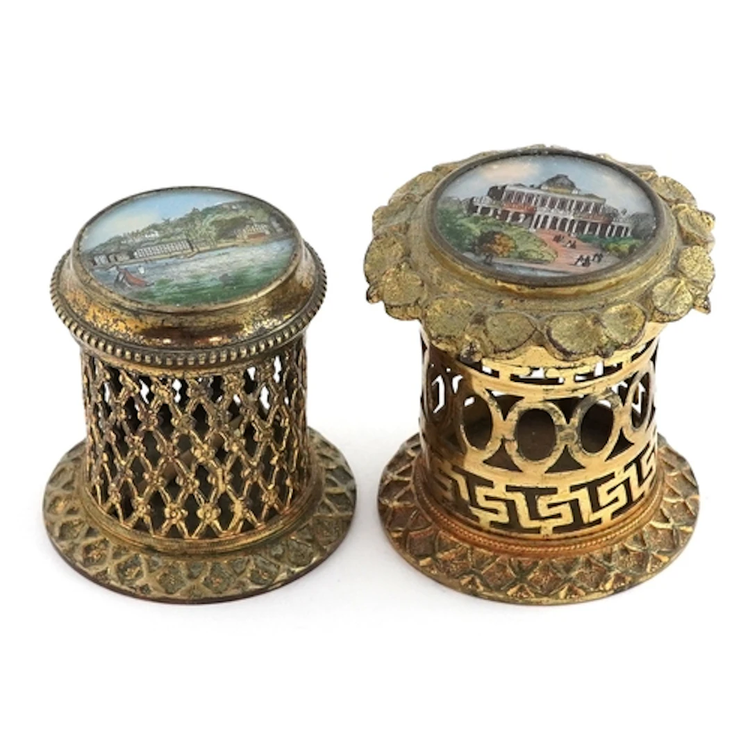 Two 19th century brass match holders and covers with hand pa...