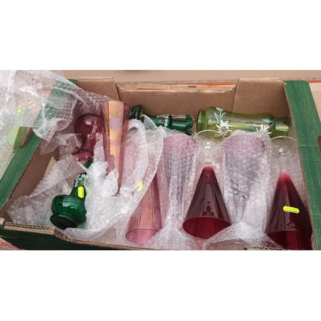 A collection of coloured glassware, including ruby glass cha...