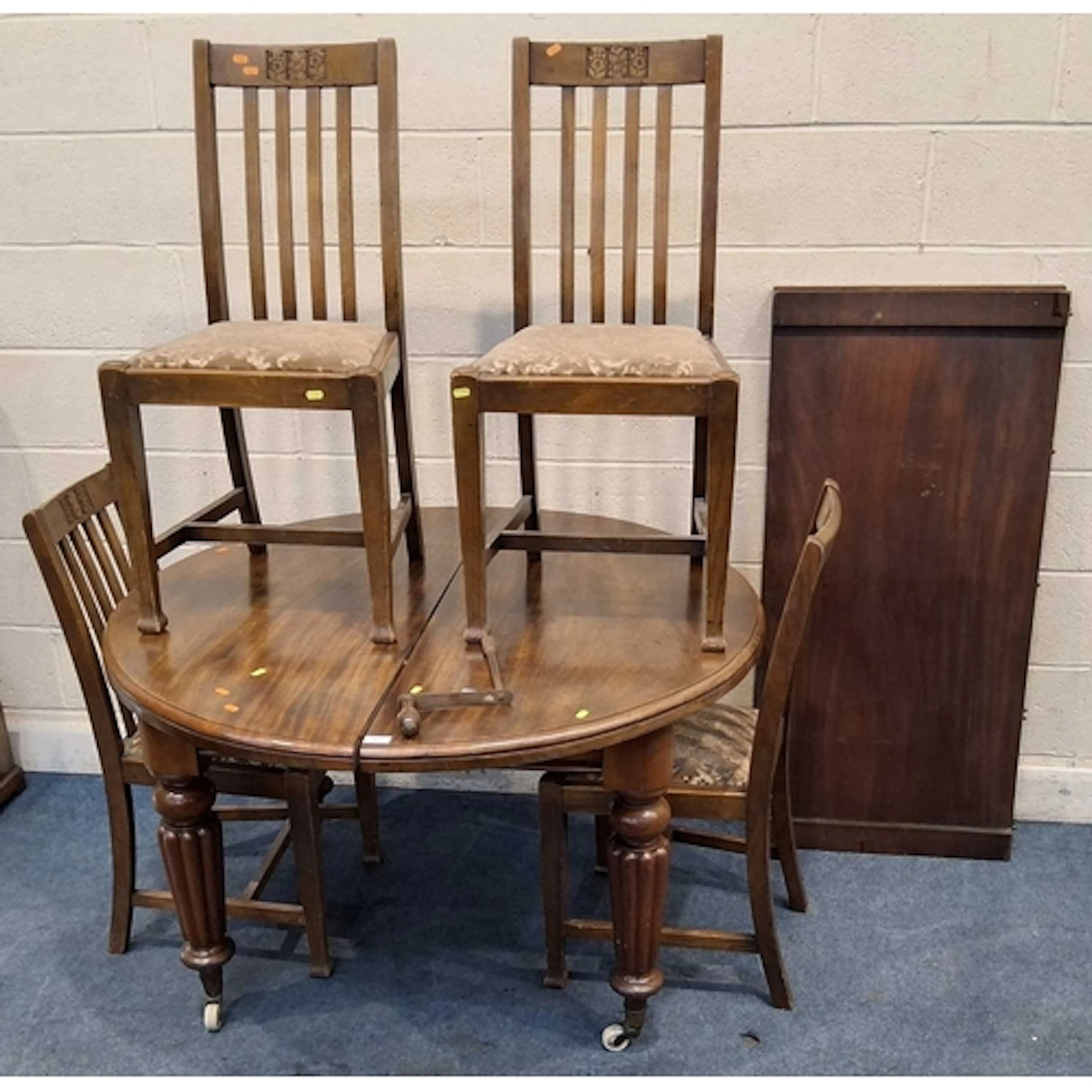 A VICTORIAN MAHOGANY WIND OUT DINING TABLE, with two additio...