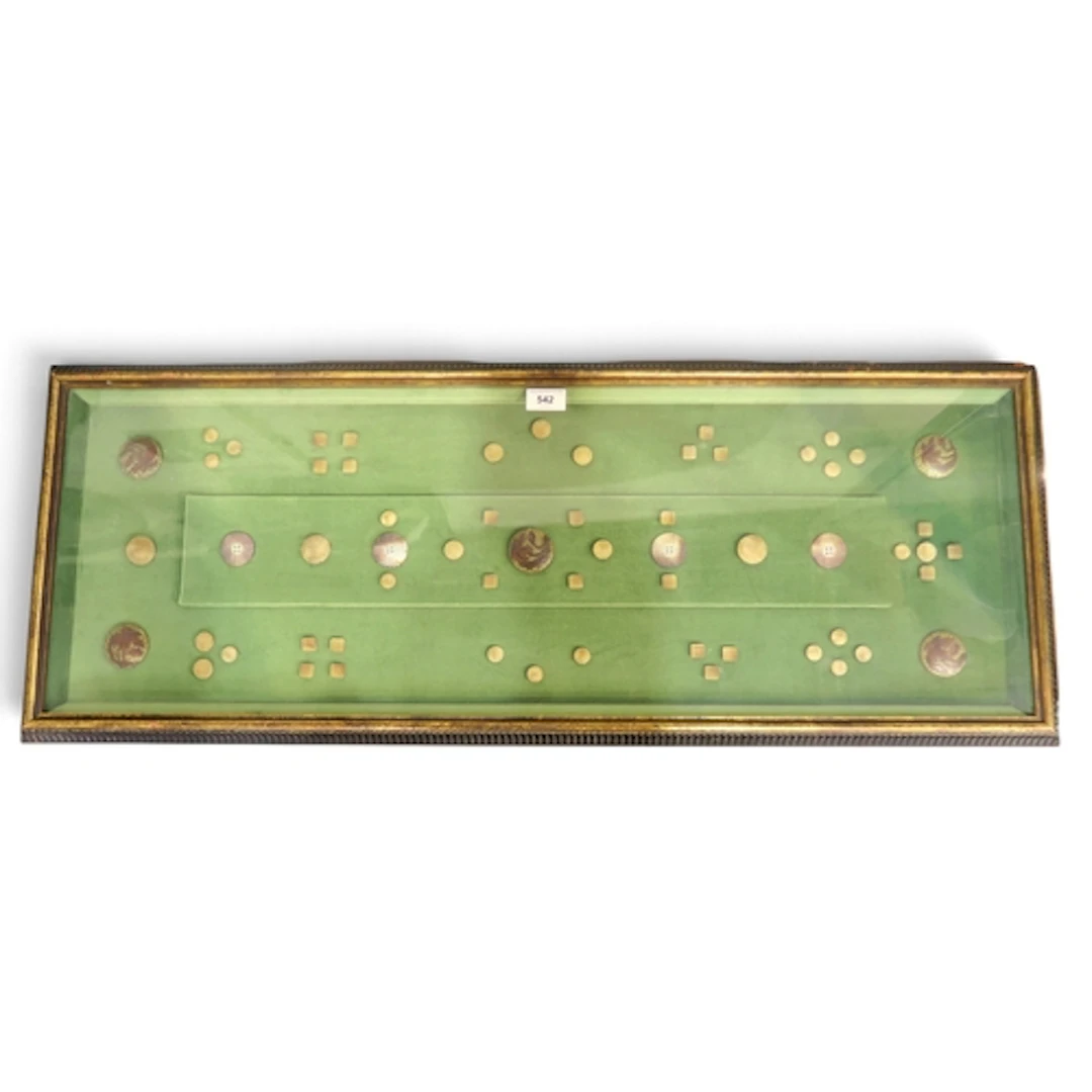 An unusual framed display of antique North American buttons,...