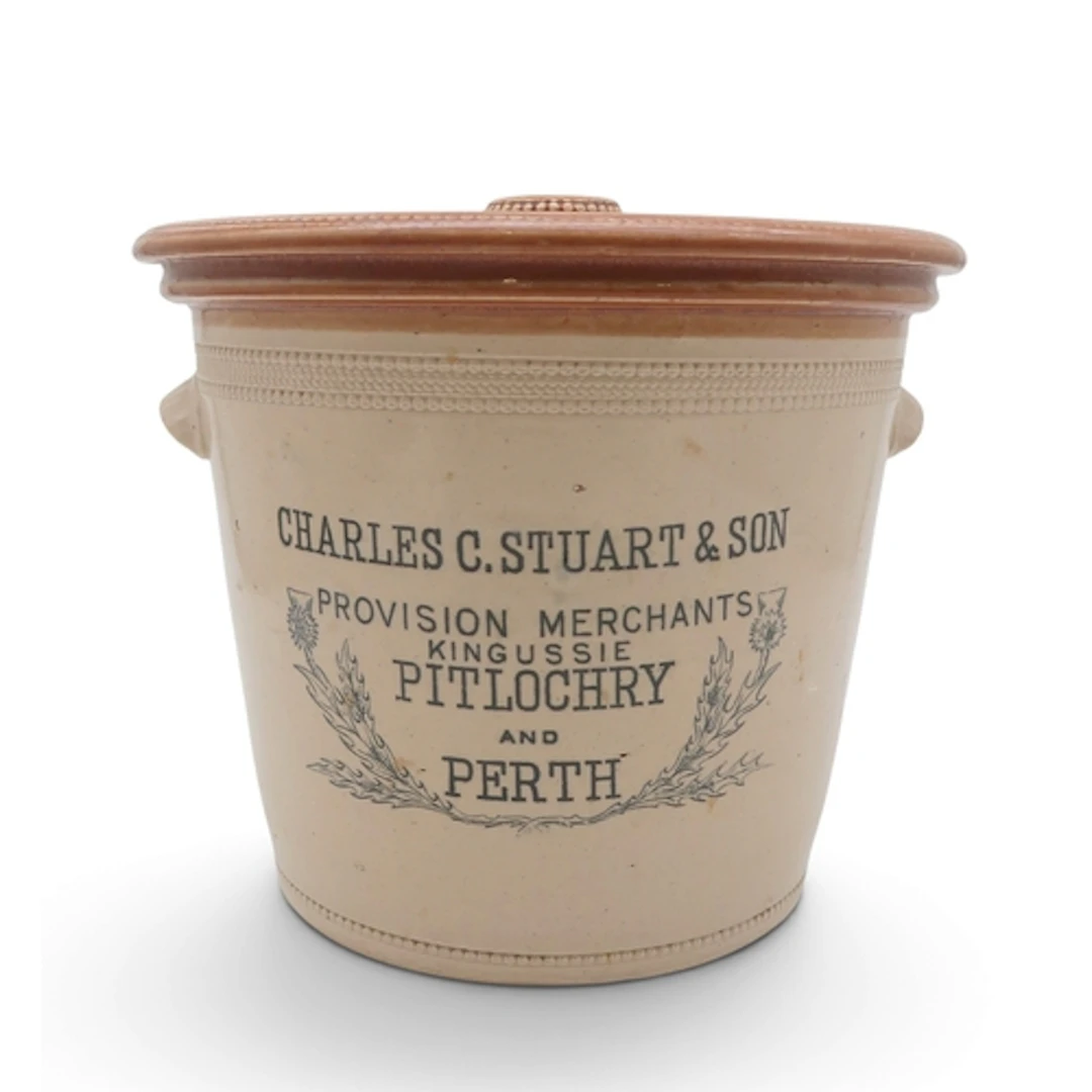 A Buchan stoneware butter crock and cover advertising C...