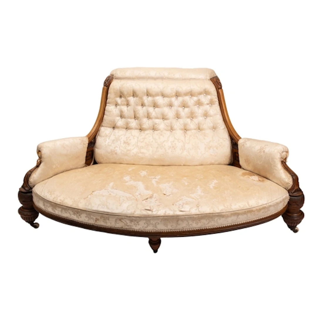 A Victorian carved walnut and upholstered settee, circa 1875...