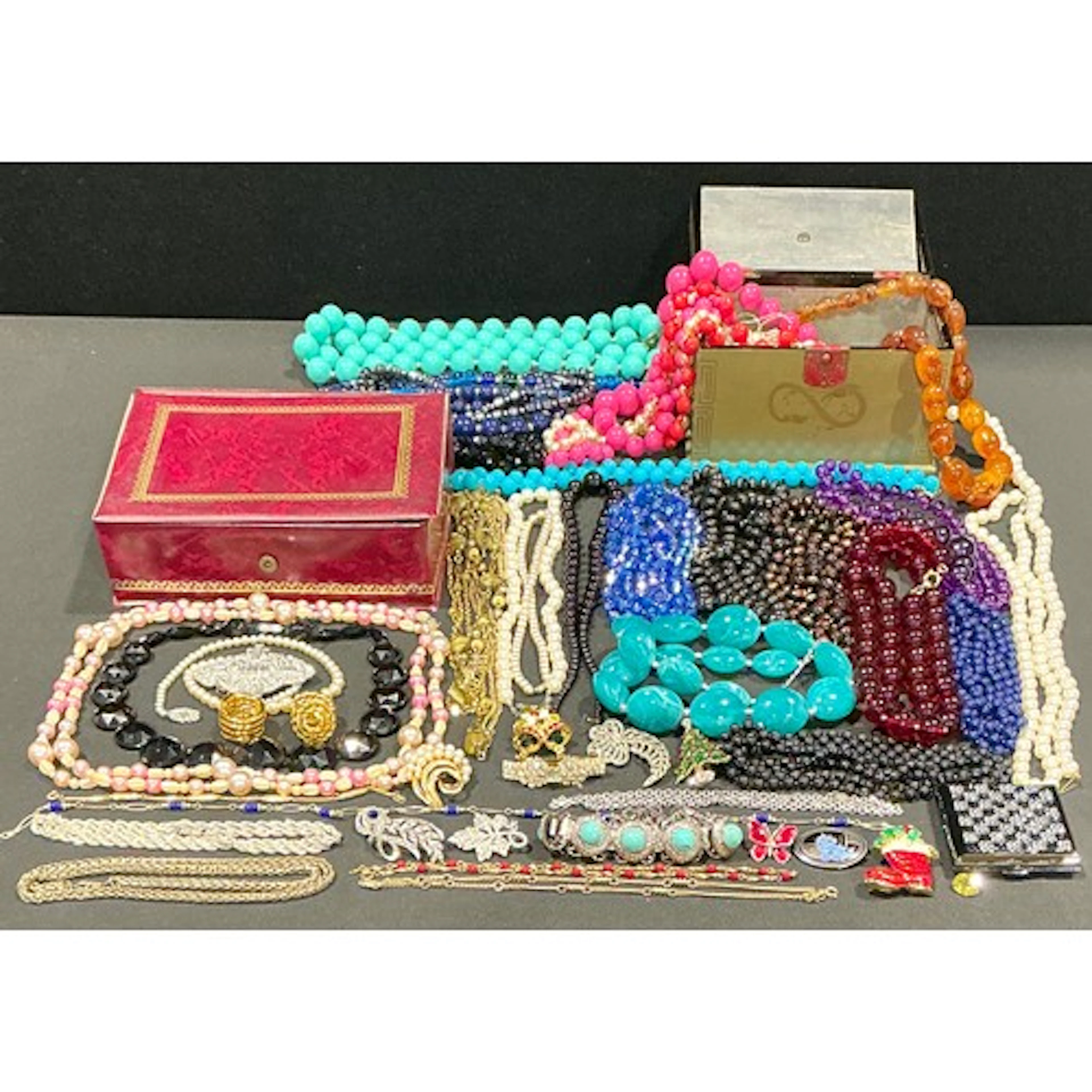 A selection of costume jewellery, to include a round black ...