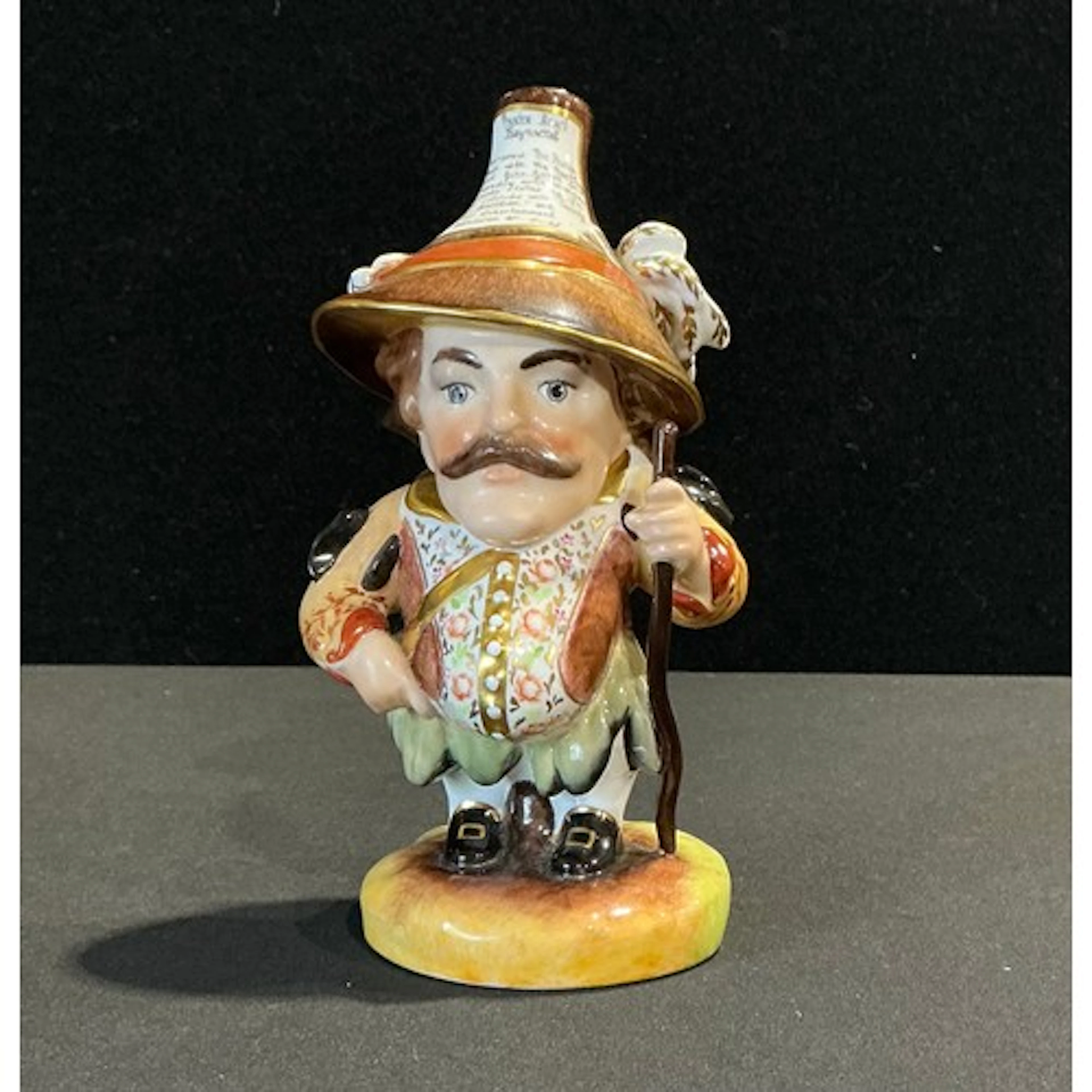 A Royal Crown Derby Mansion House dwarf, richly attired in 1...