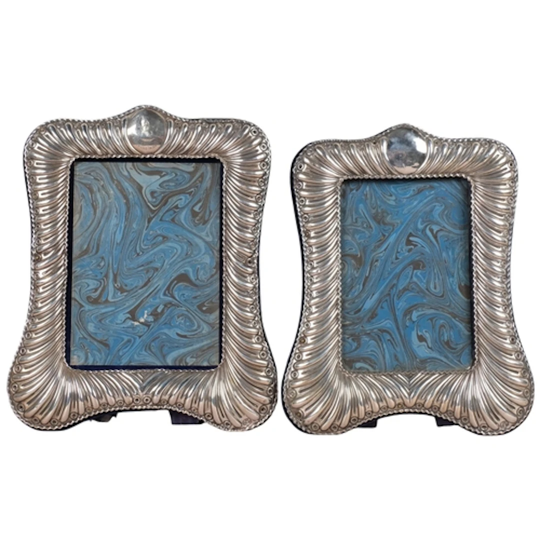 A graduated pair of late Victorian silver photo frames, Will...