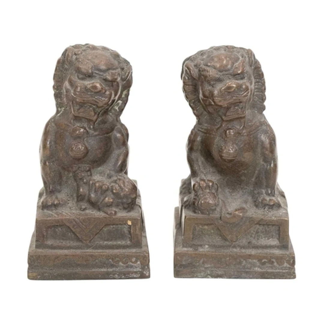 A pair of Chinese bronze foo dogs or temple guardians. 19th/...