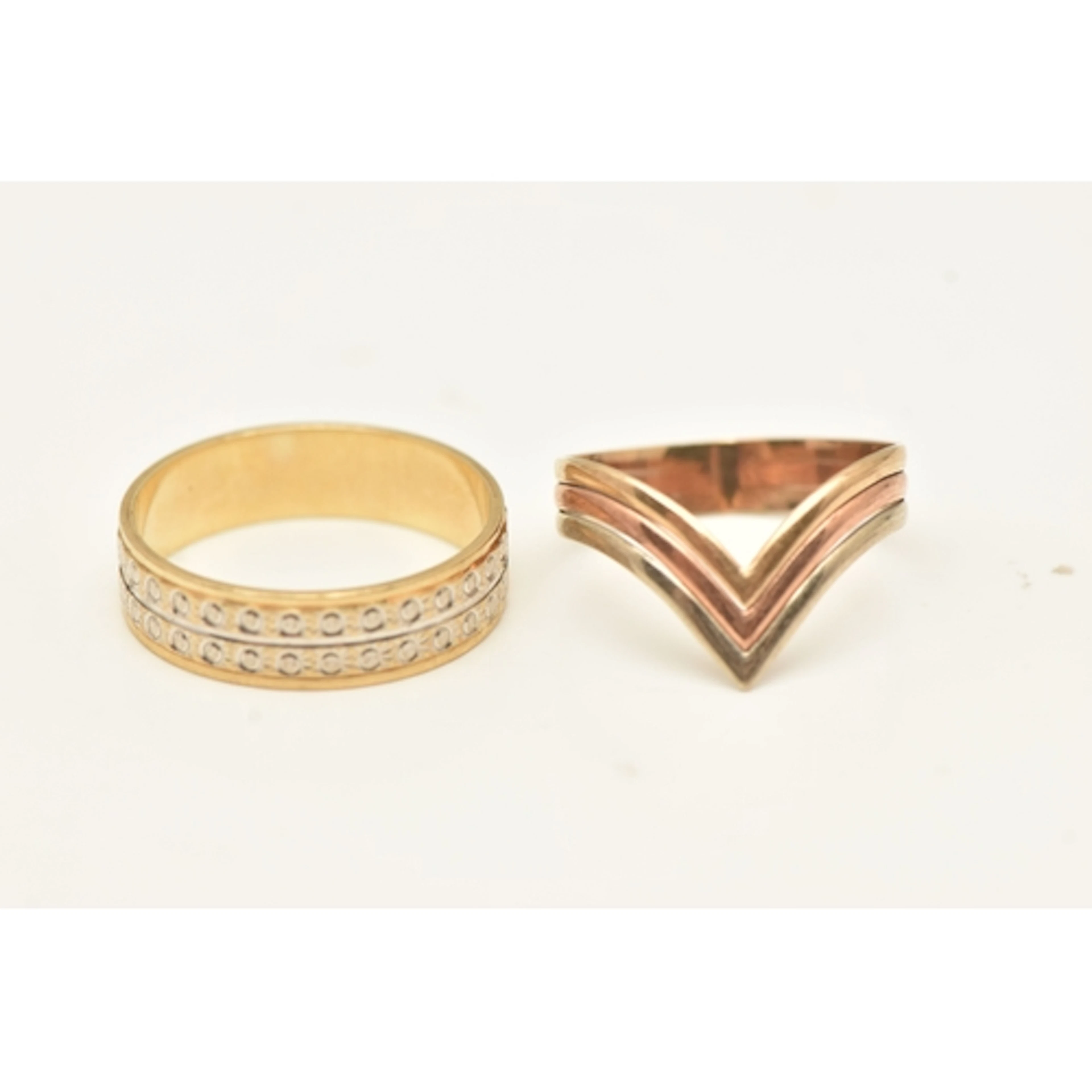 TWO RINGS, a 9ct bi-colour band ring, hallmarked 9ct Sheffie...