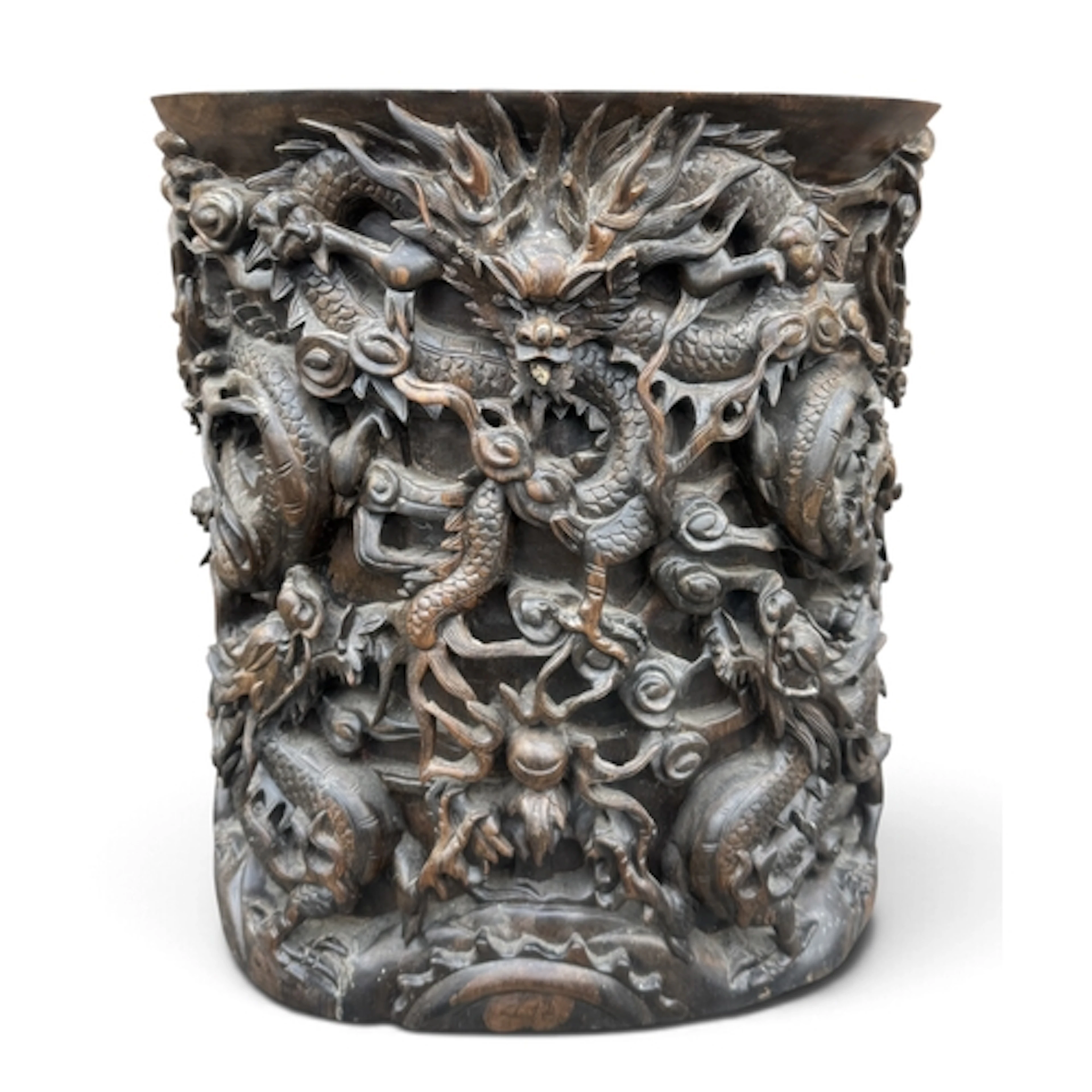 A CHINESE QING DYNASTY PROFUSELY CARVED DRAGON STICK STAND T...