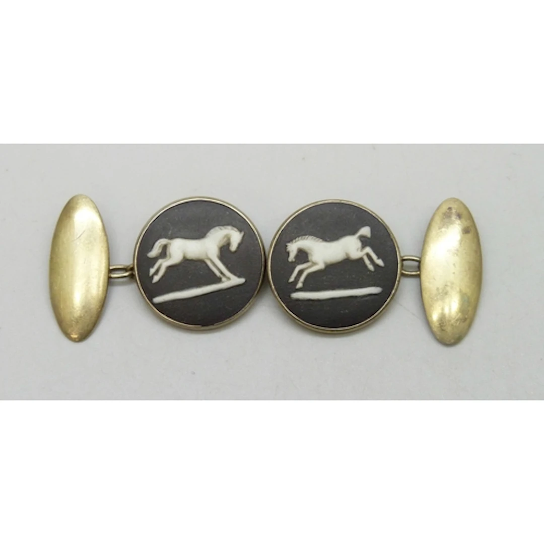 A pair of gold plated silver Wedgwood cufflinks set with bla...