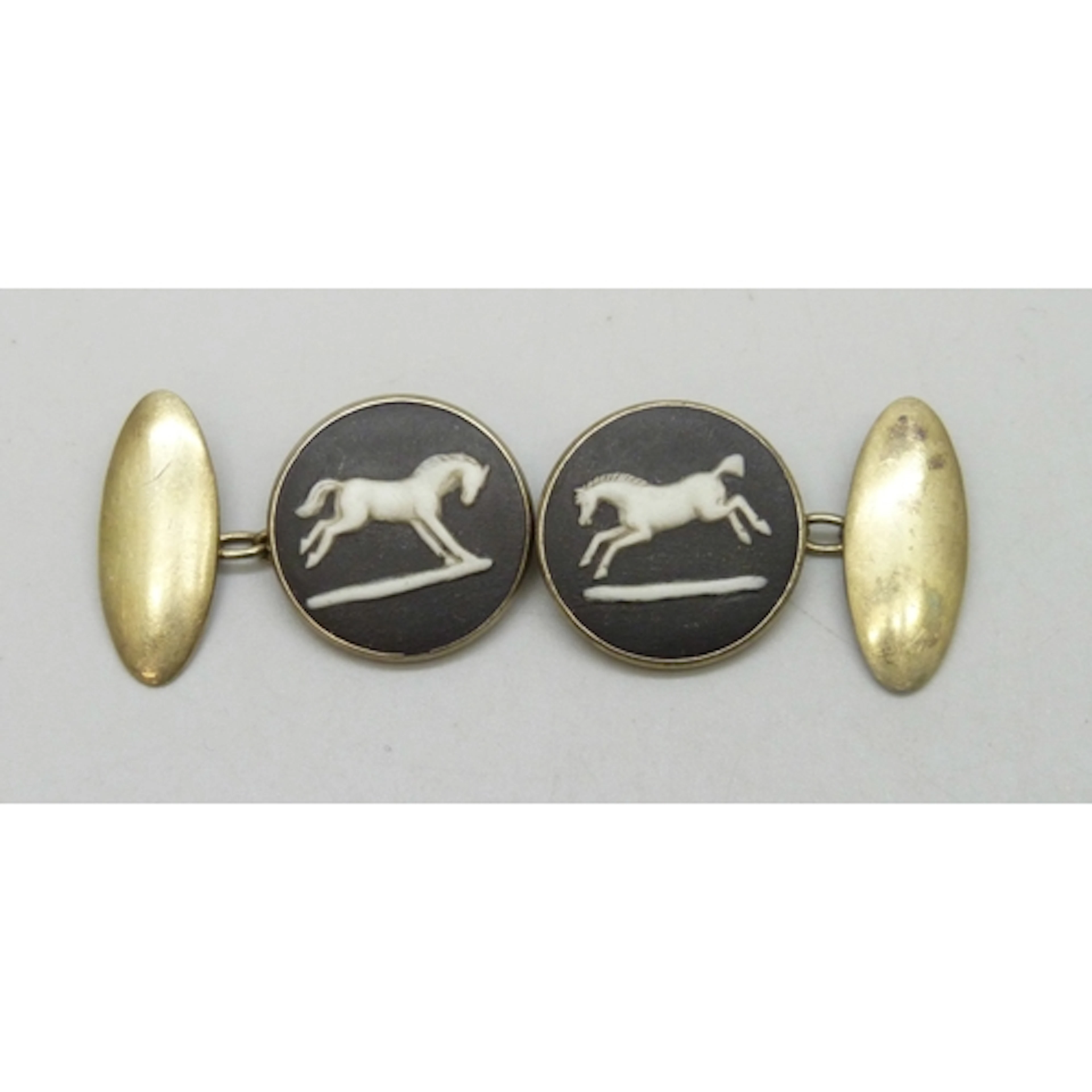 A pair of gold plated silver Wedgwood cufflinks set with bla...