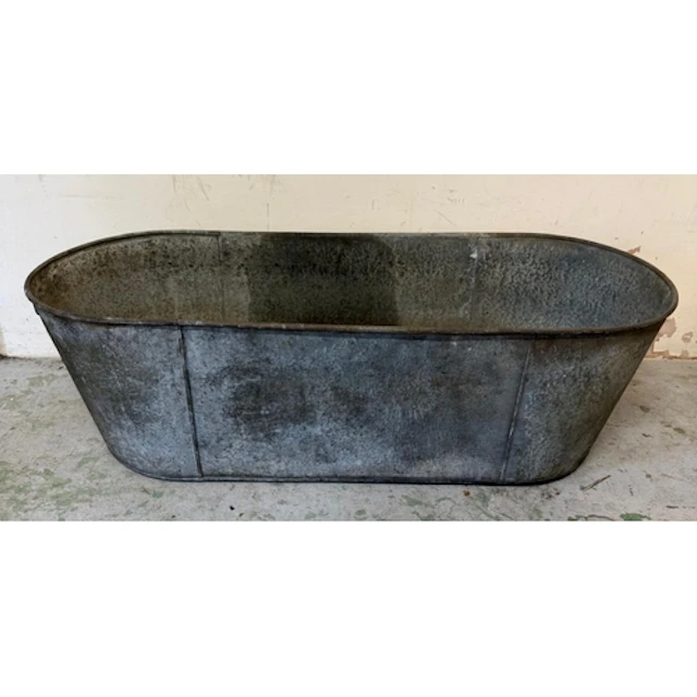 A galvanised metal bath. ...