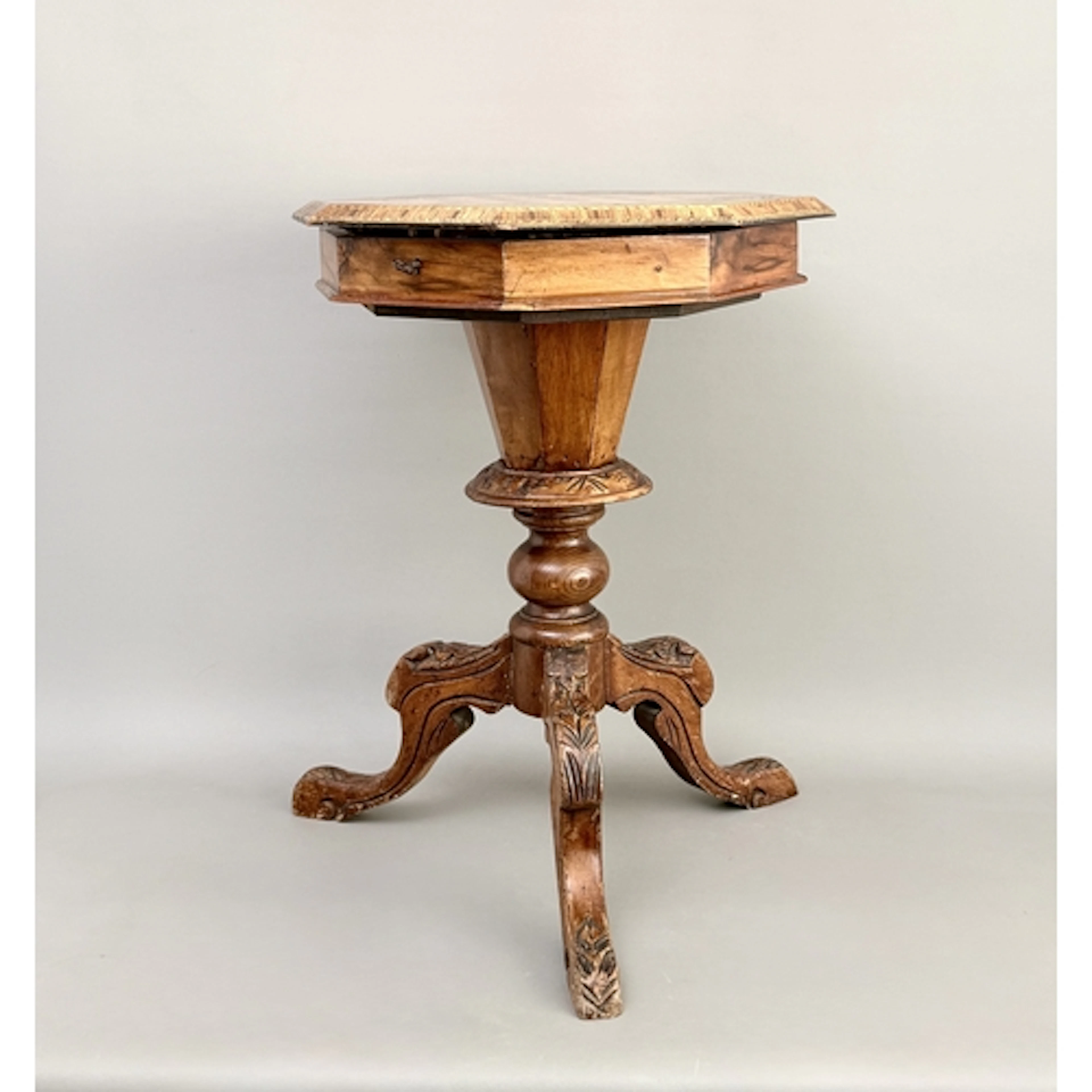 A Victorian inlaid and carved walnut trumpet games work tabl...