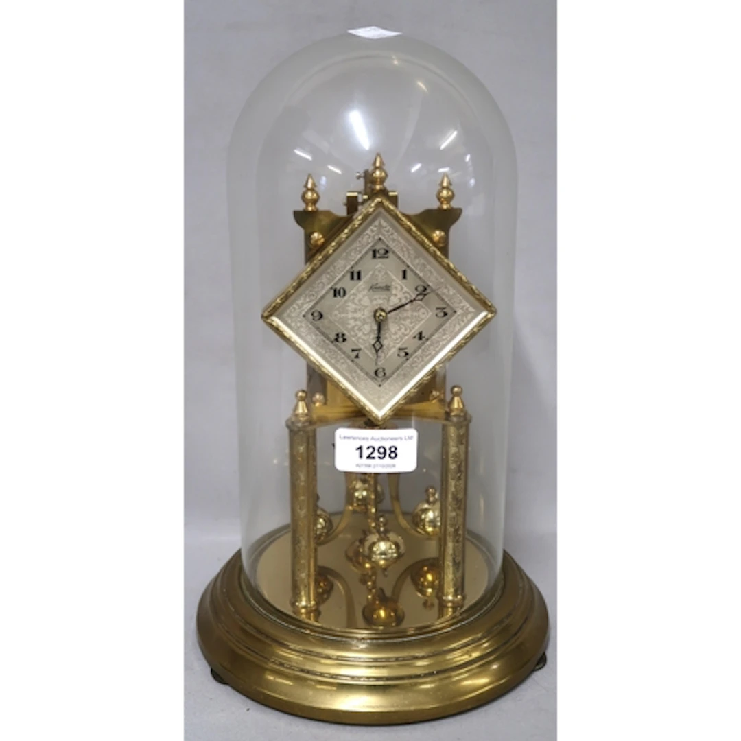 Three various brass three hundred day clocks, with glass dom...