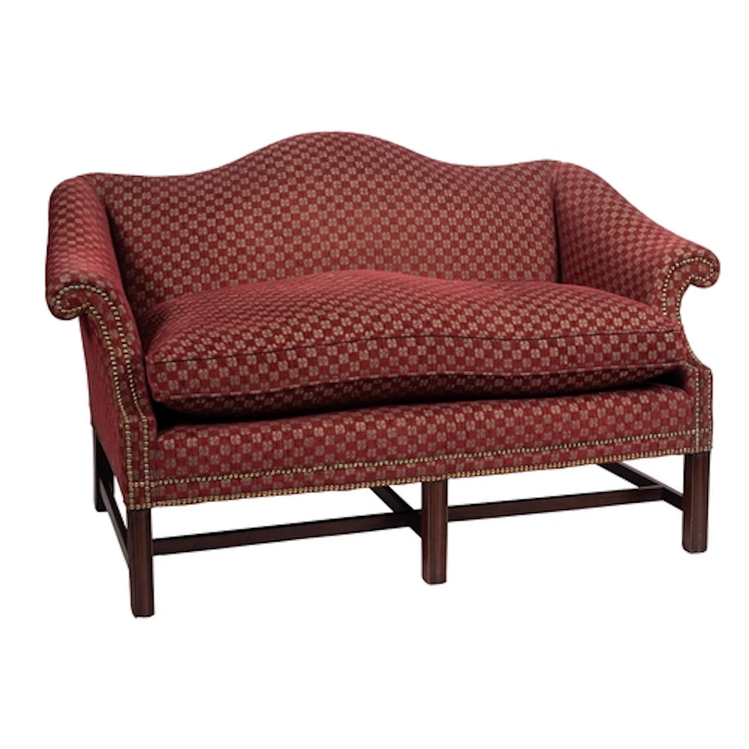 A mahogany and upholstered 'camel back' sofa in George III s...